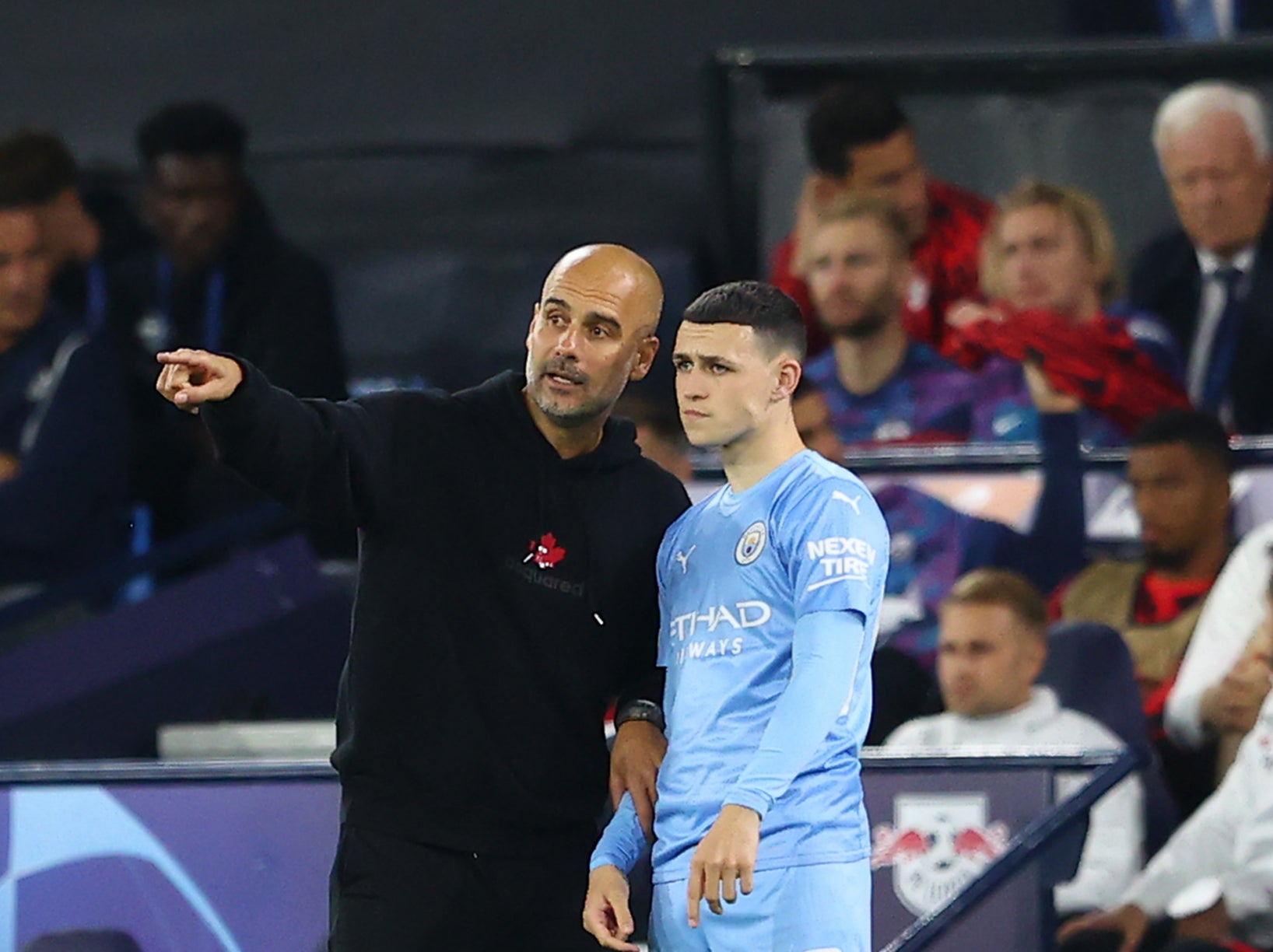 Phil Foden with Manchester City coach Pep Guardiola