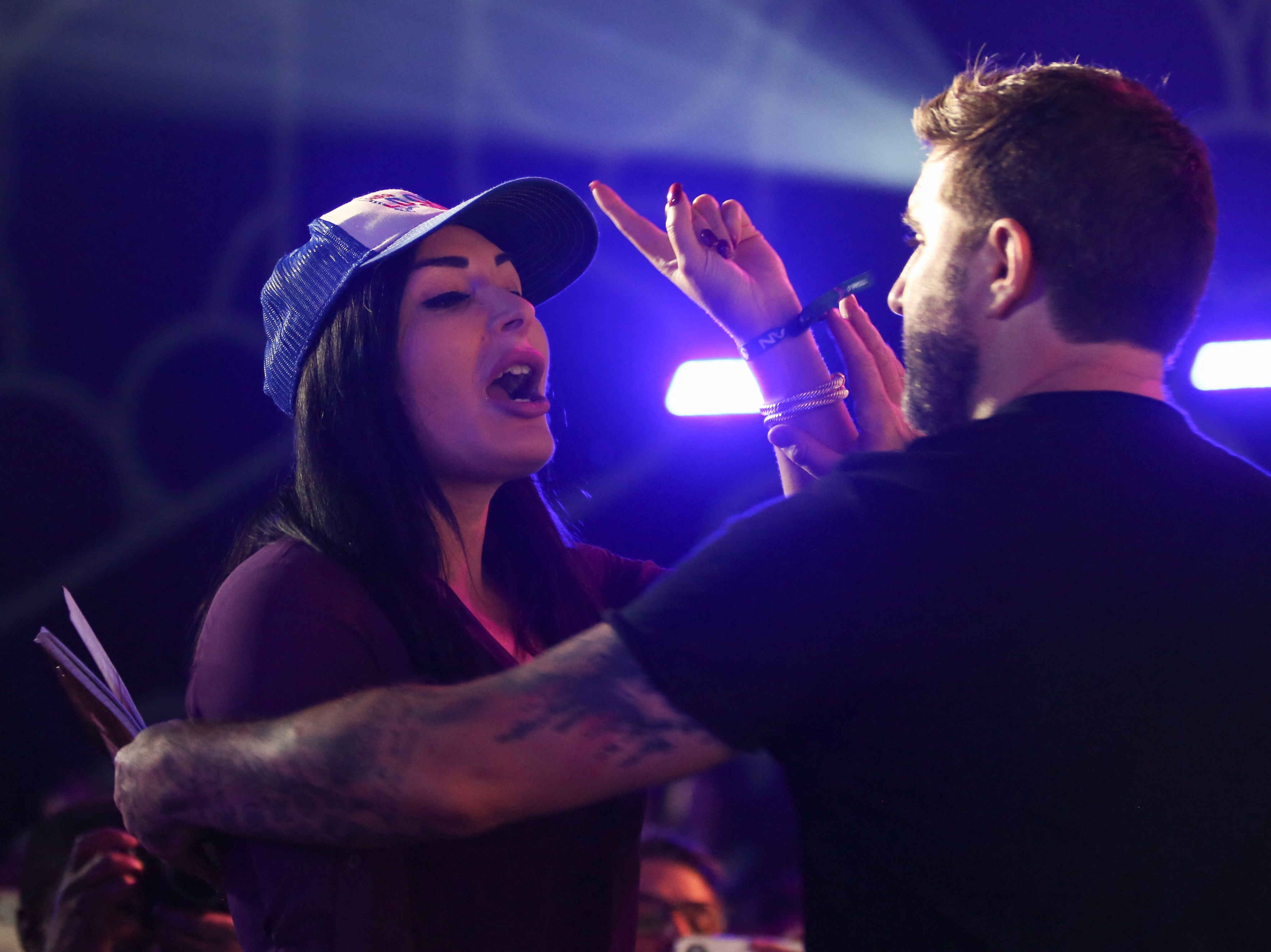 Republican activist Laura Loomer shouts at Jack Dorsey as he speaks on stage during the cryptocurrency conference, Bitcoin 2021