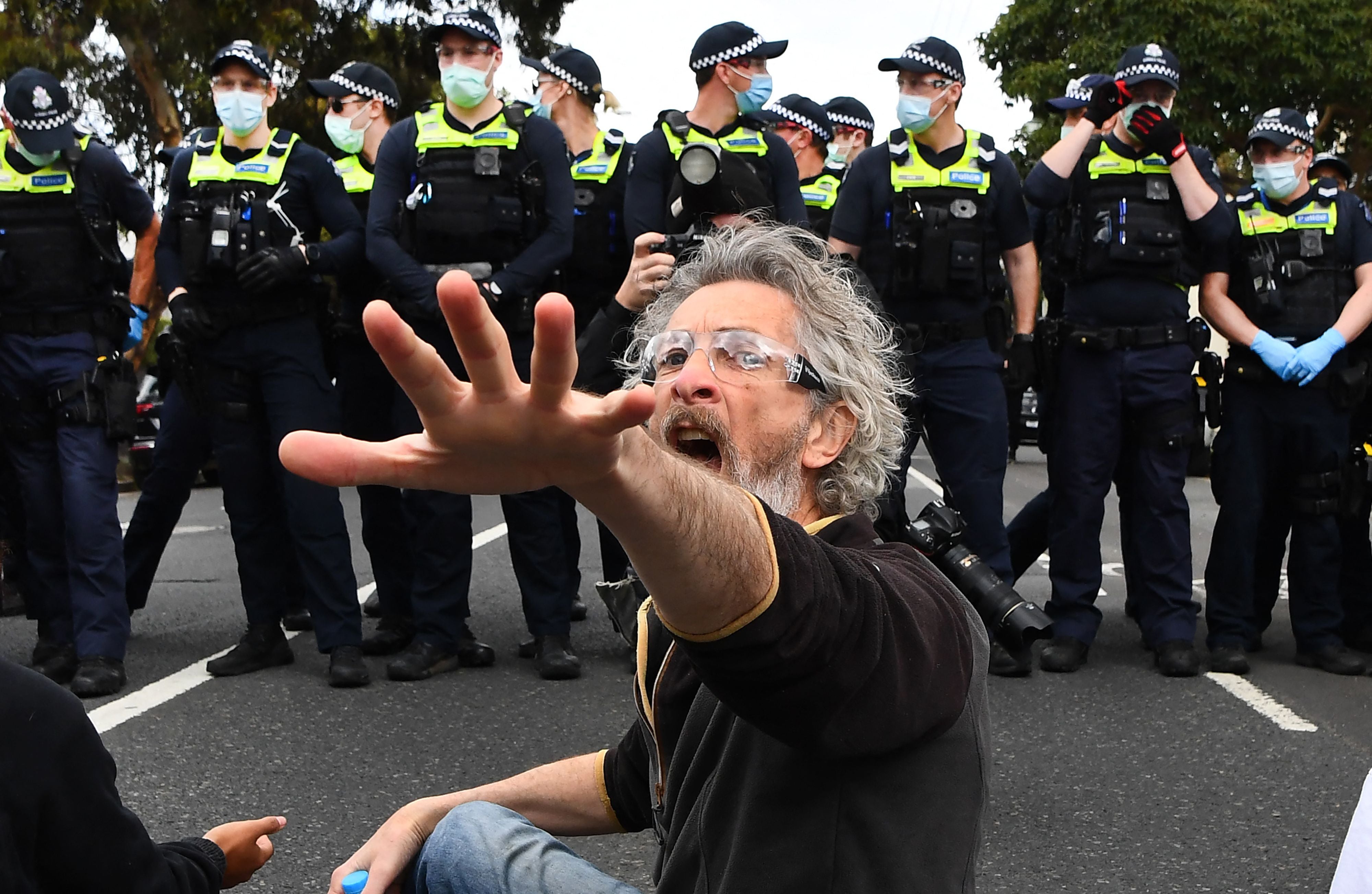 Protesters sat in the road en masse in front of officers