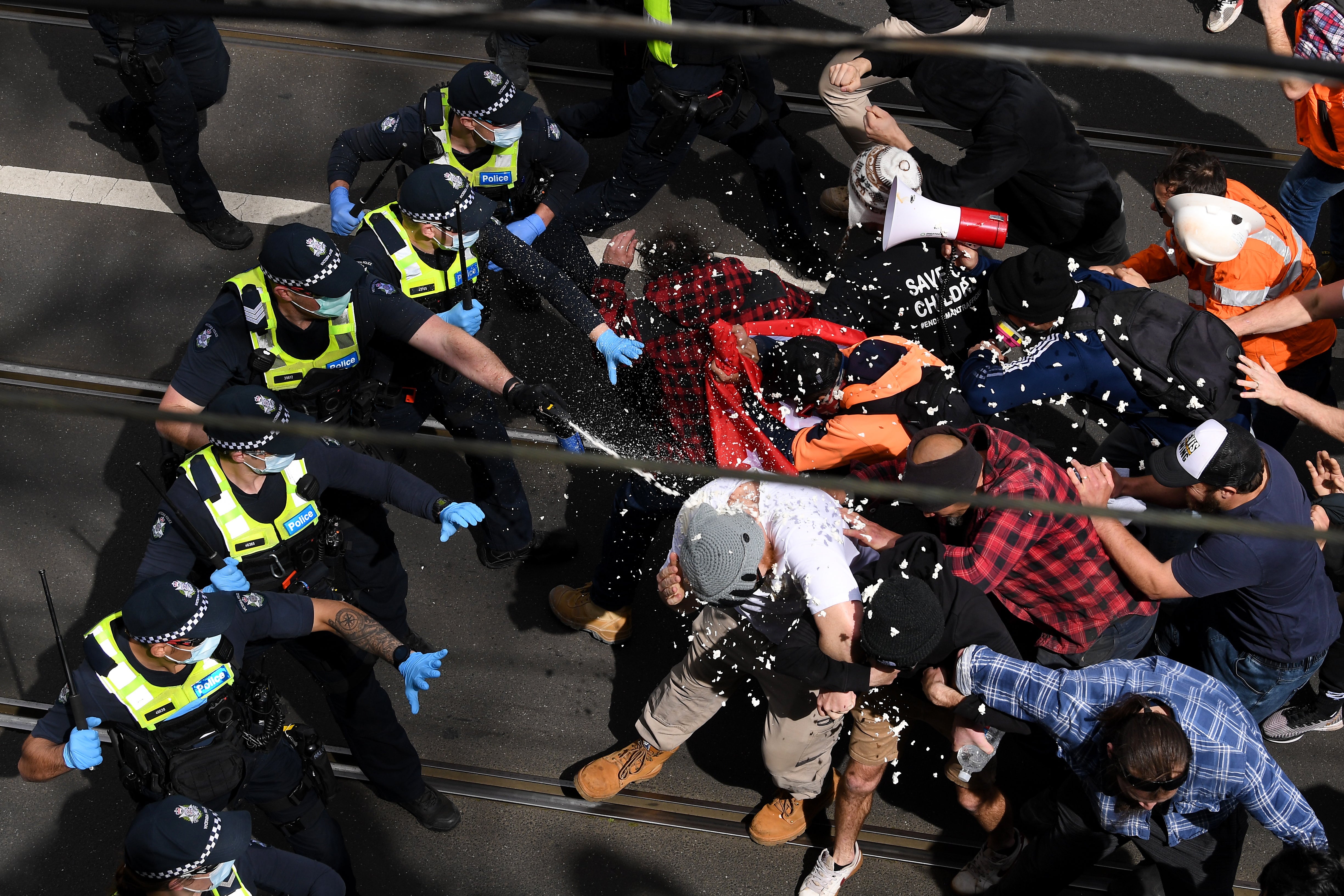 Victoria Police clash with protesters during ‘The Worldwide Rally for Freedom’ in Melbourne