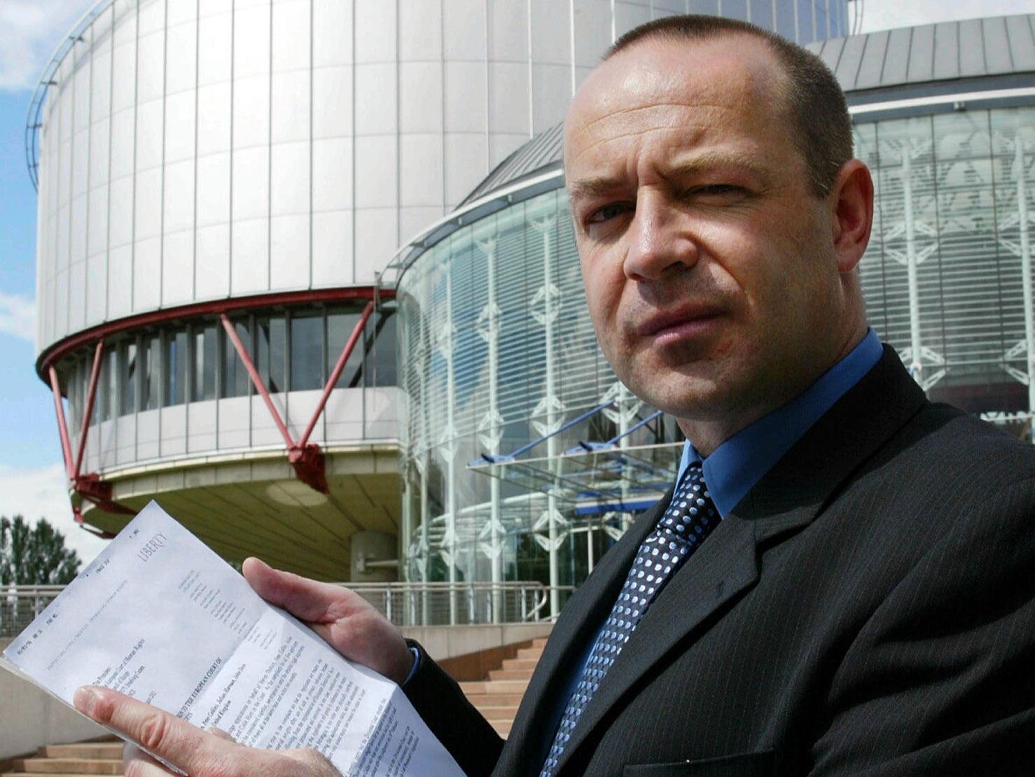 Neil Herron pictured with a petition next to the European Court of Human Rights in August 2002