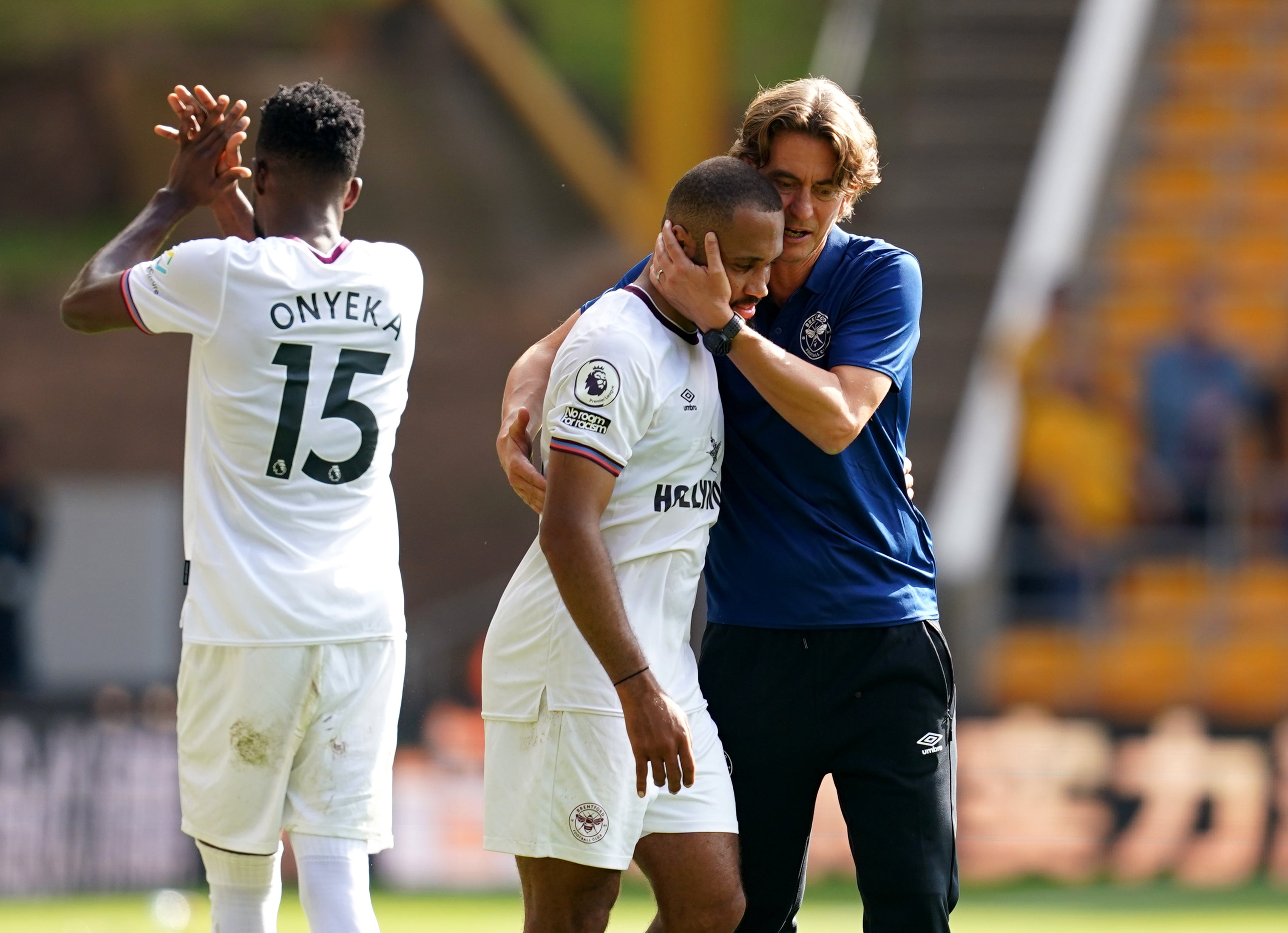 Brentford manager Thomas Frank congratulates his players after their win at Wolves (David Davies/PA).