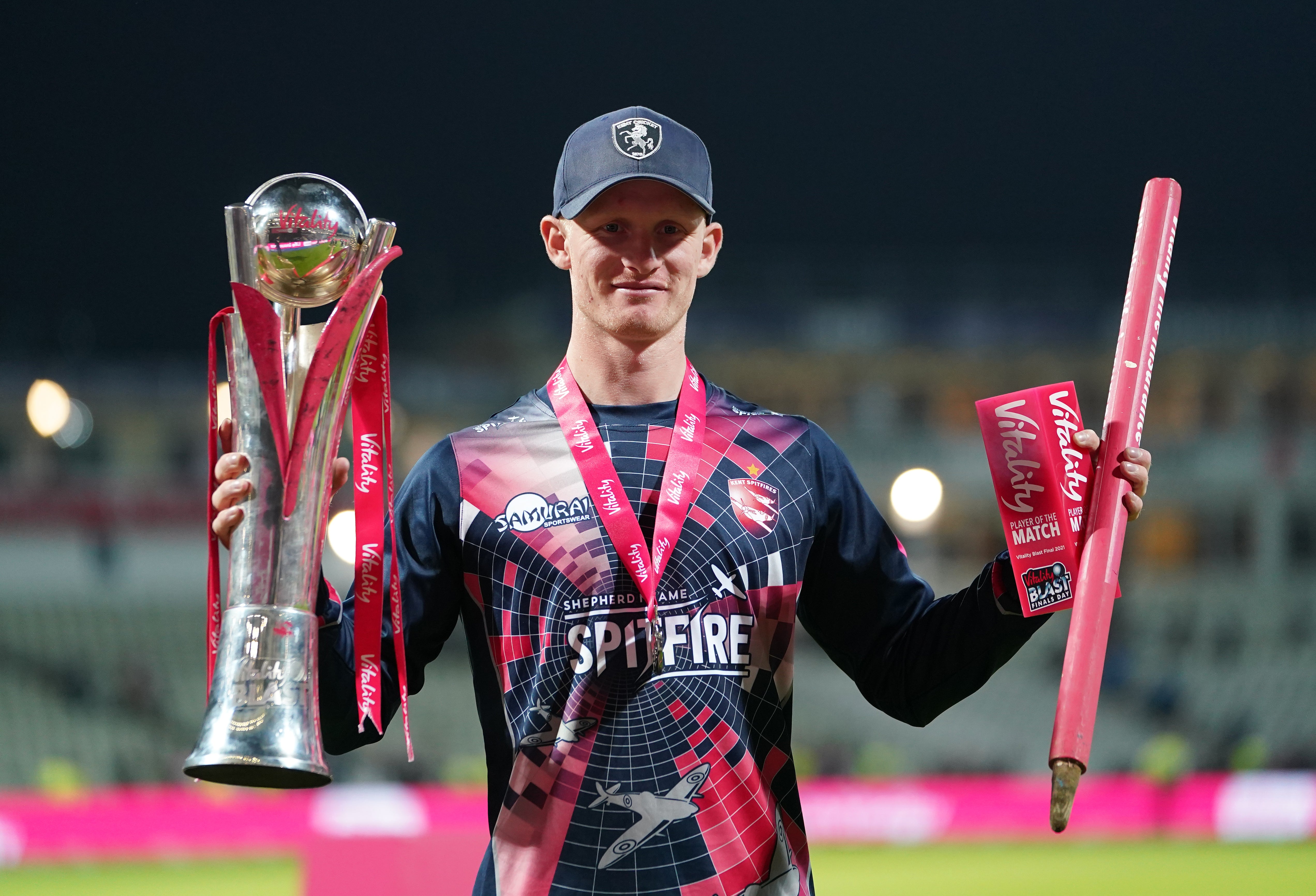 Jordan Cox celebrates with the trophy and the player of the match award (Mike Egerton/PA)