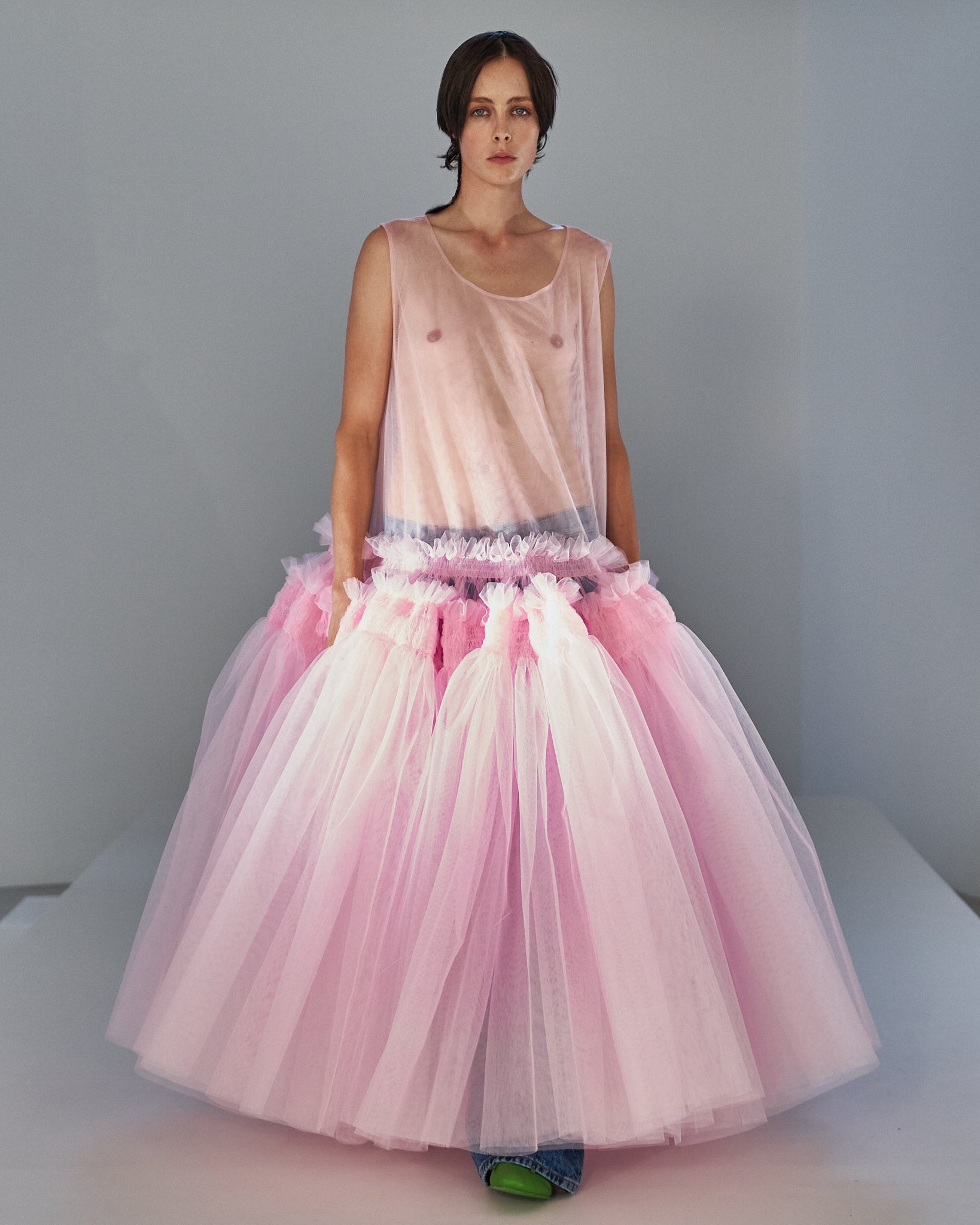 Edie Campbell walking the runway in a sheer pink Molly Goddard dress