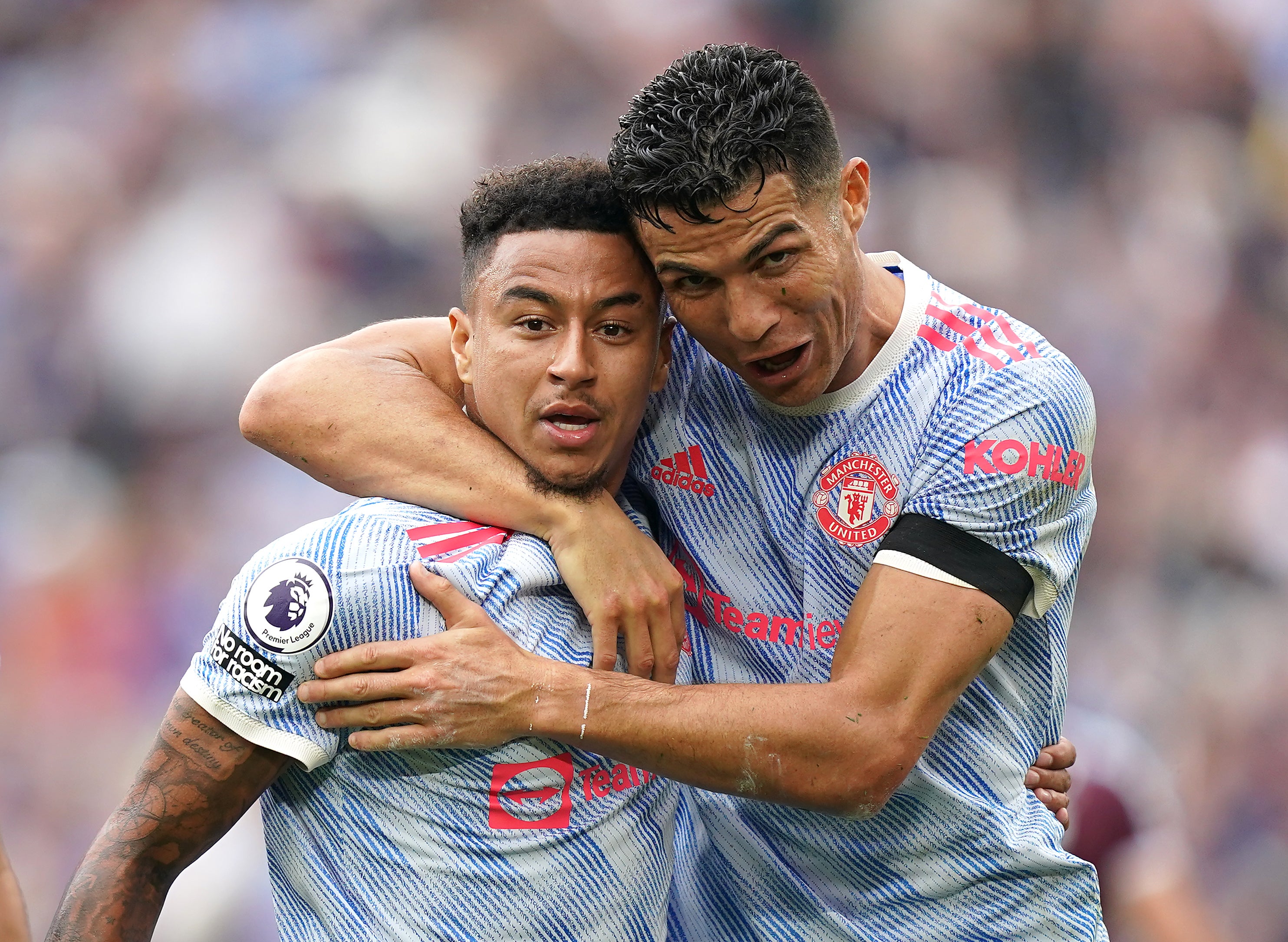 Lingard (left) celebrates scoring the winning goal with Ronaldo