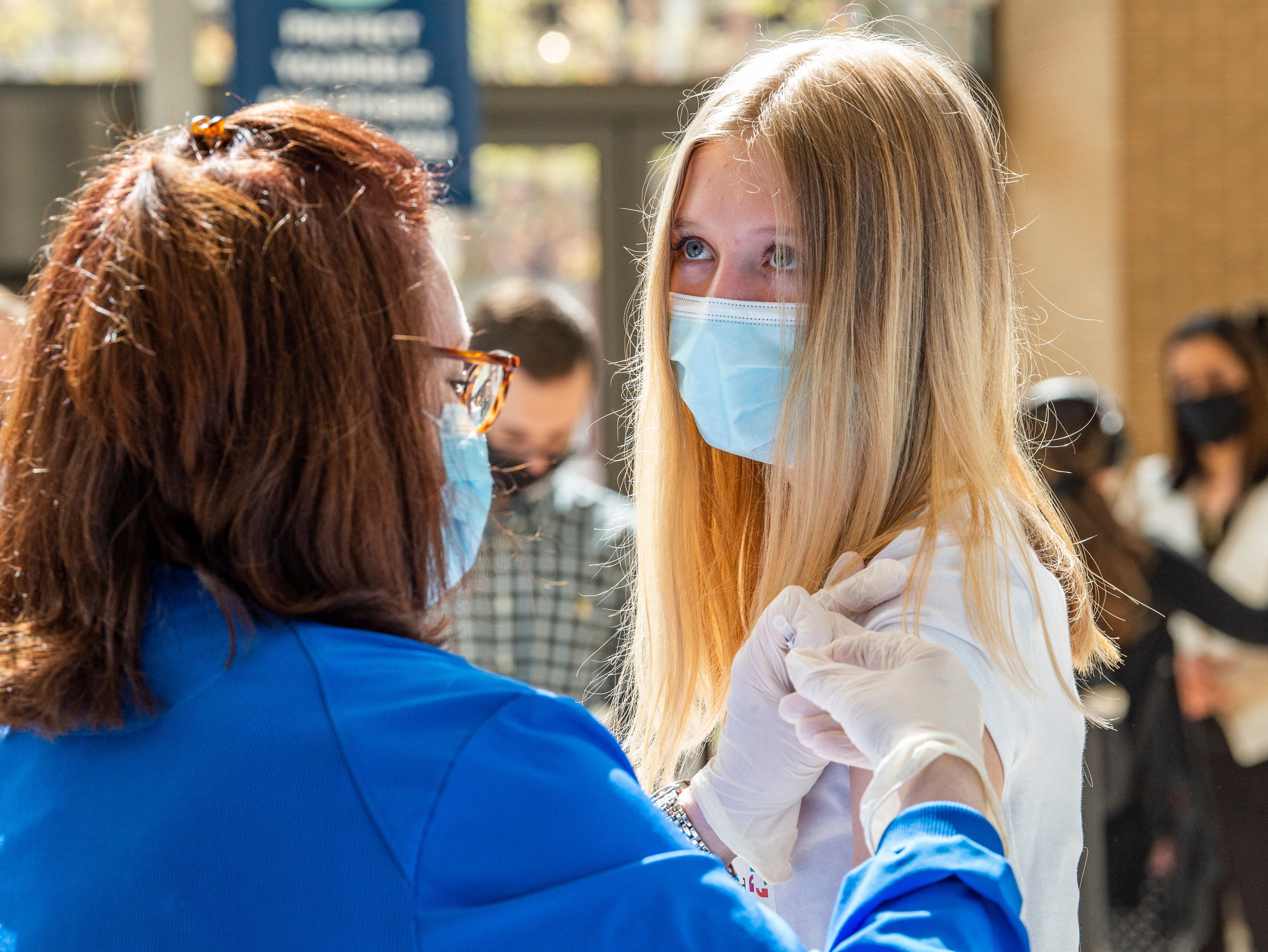 Representational: A teenager is inoculated with a Covid-19 vaccine in the US