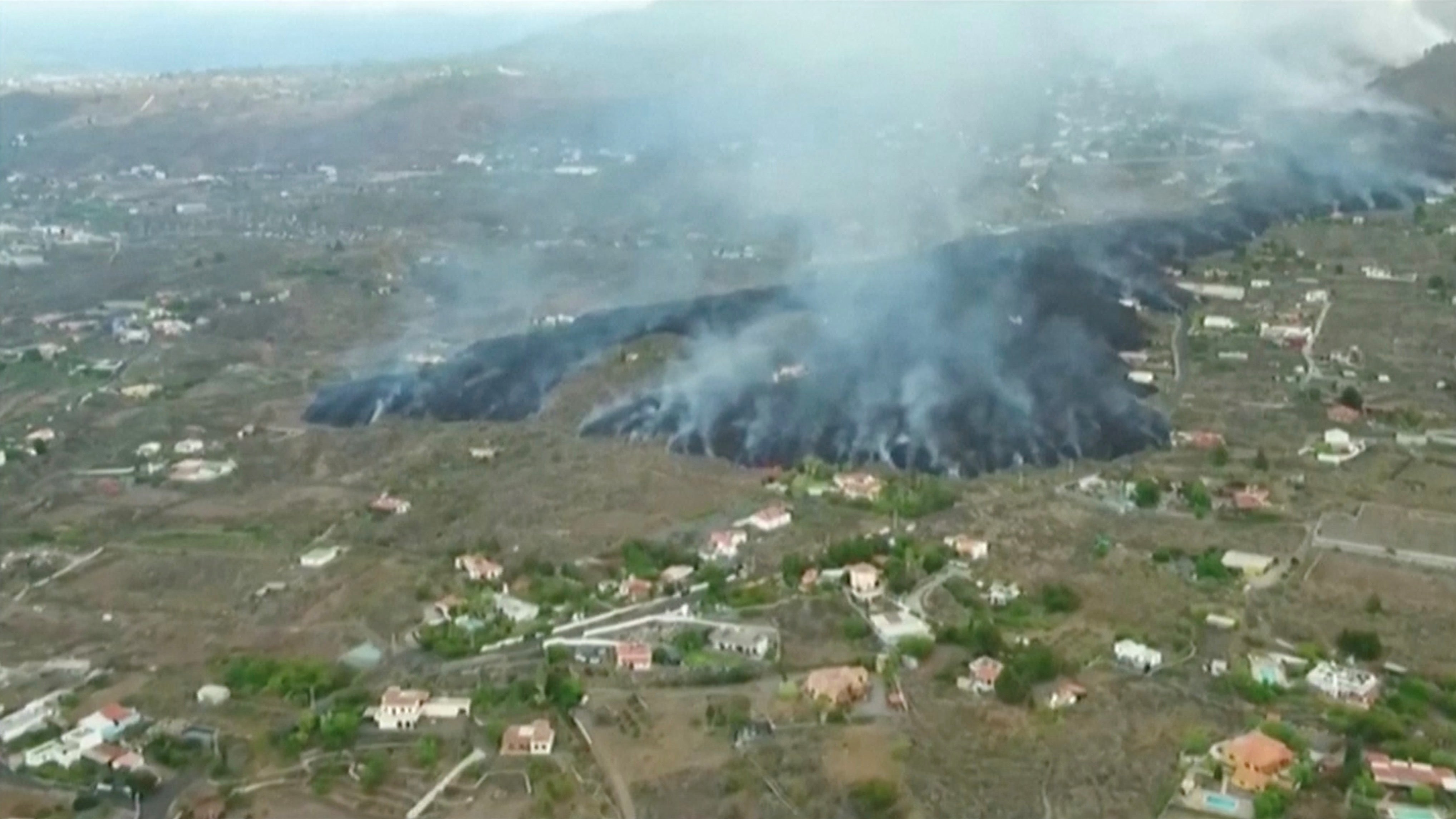 A screen grab from drone footage shows lava flowing following the eruption of a volcano in the Cumbre Vieja national park