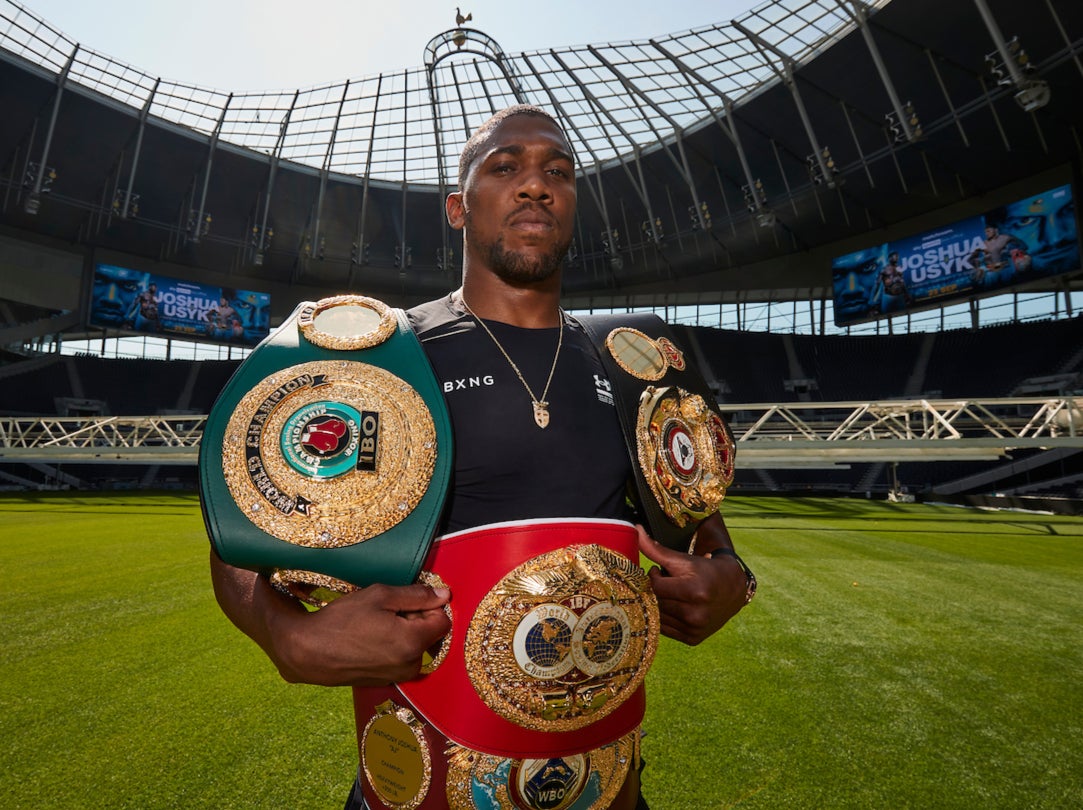 Joshua parades his world championship belts at Joshua the Tottenham Hotspur Stadium