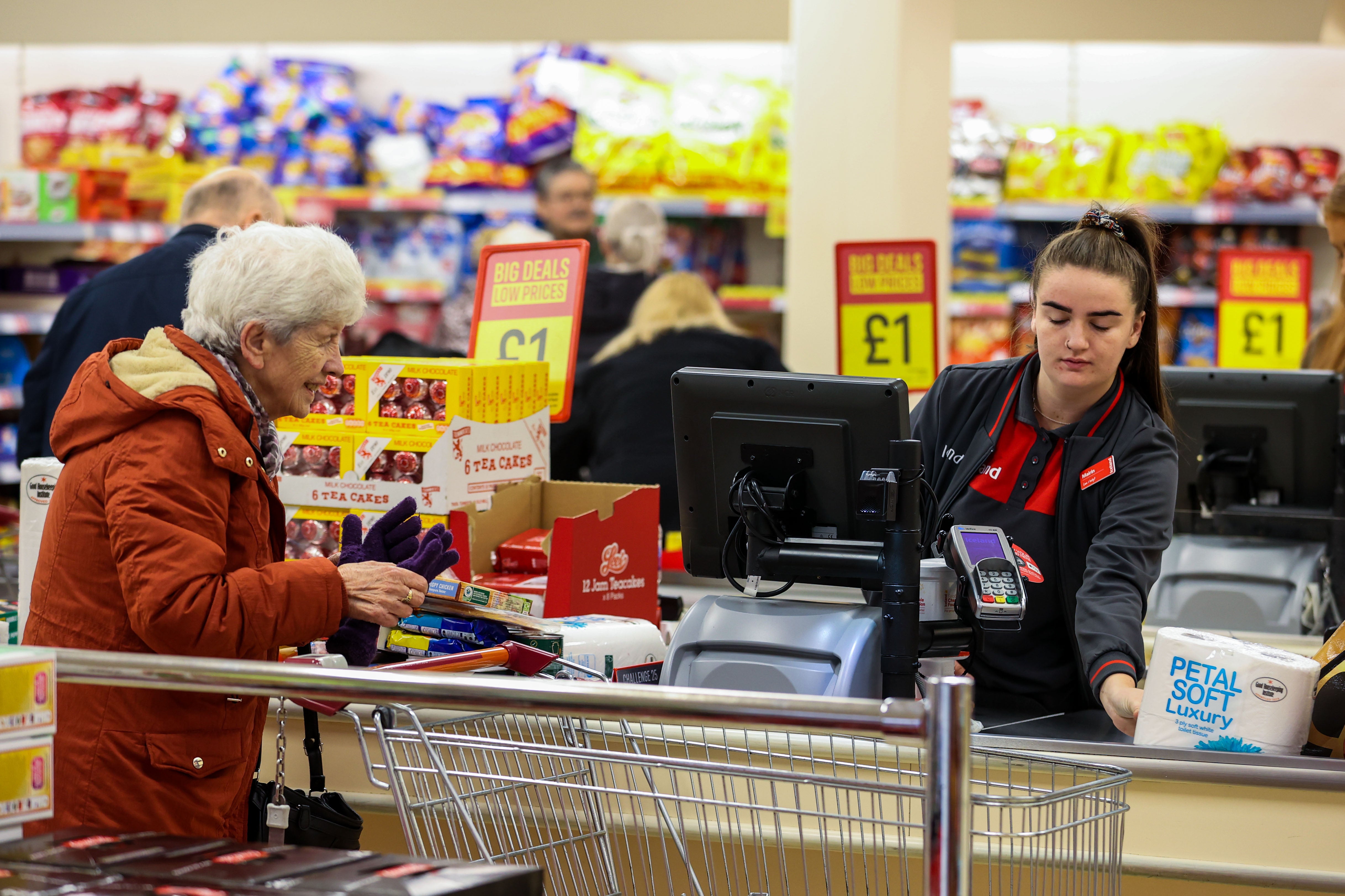 Elderly shoppers pay for their shopping at a branch of Iceland (Liam McBurney/PA)