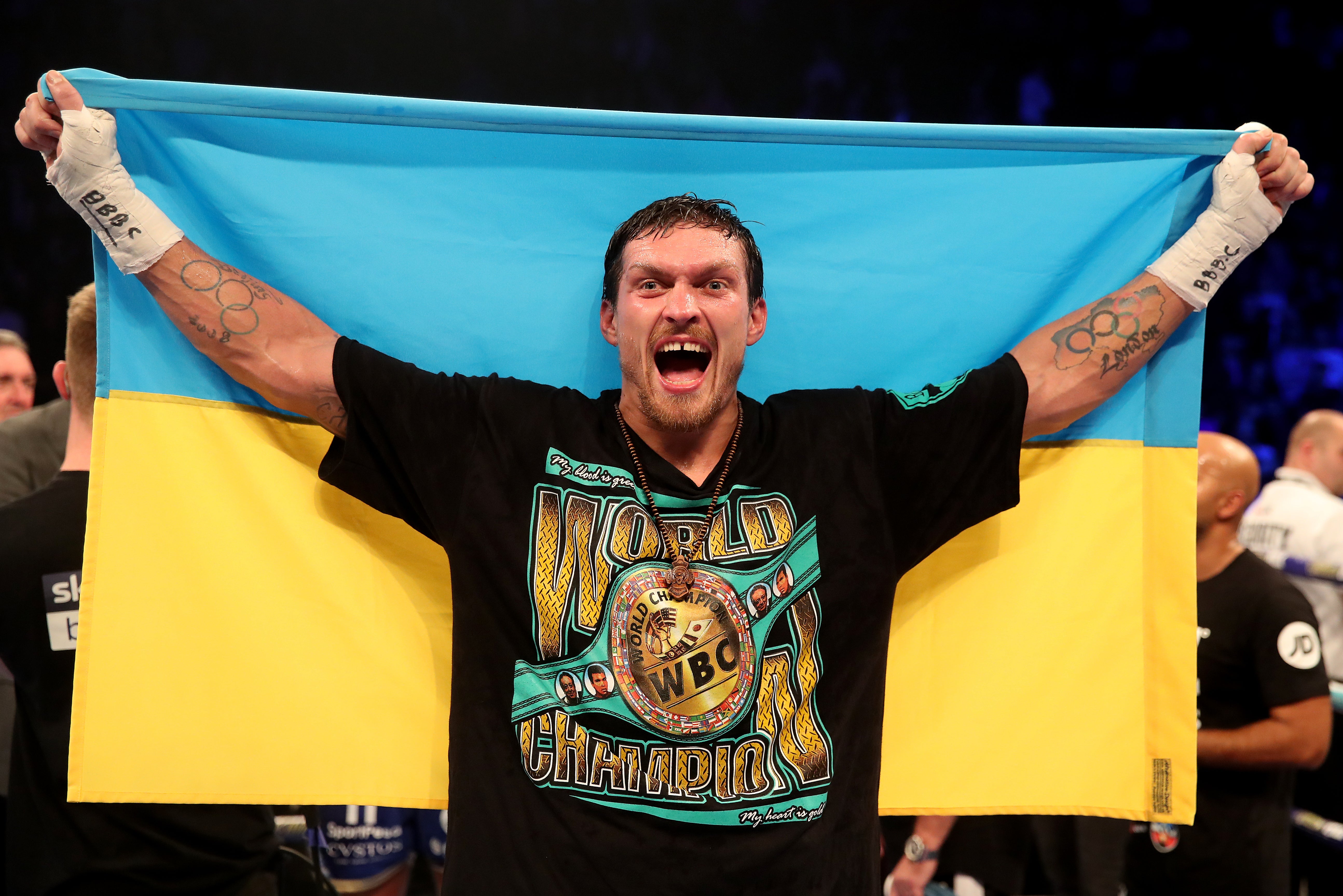 Usyk celebrates after defeating Tony Bellew