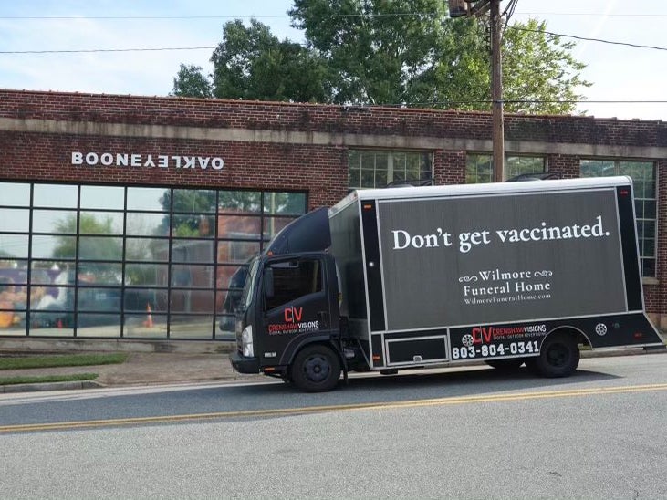 The ad truck drove around Charlotte on Sunday as football fans headed to a game