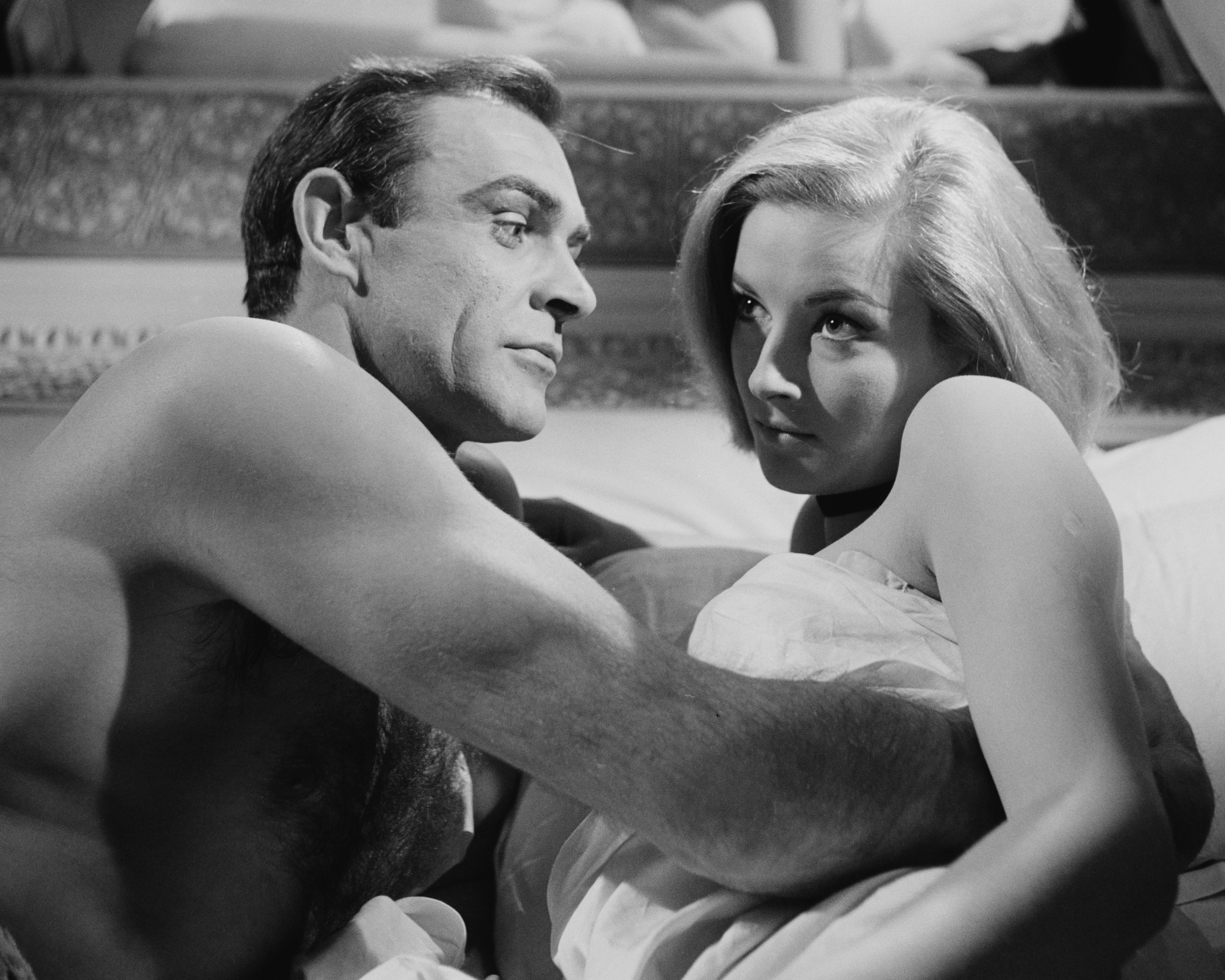 Sean Connery and actress Daniela Bianchi film a bedroom scene for the James Bond film 'From Russia With Love'