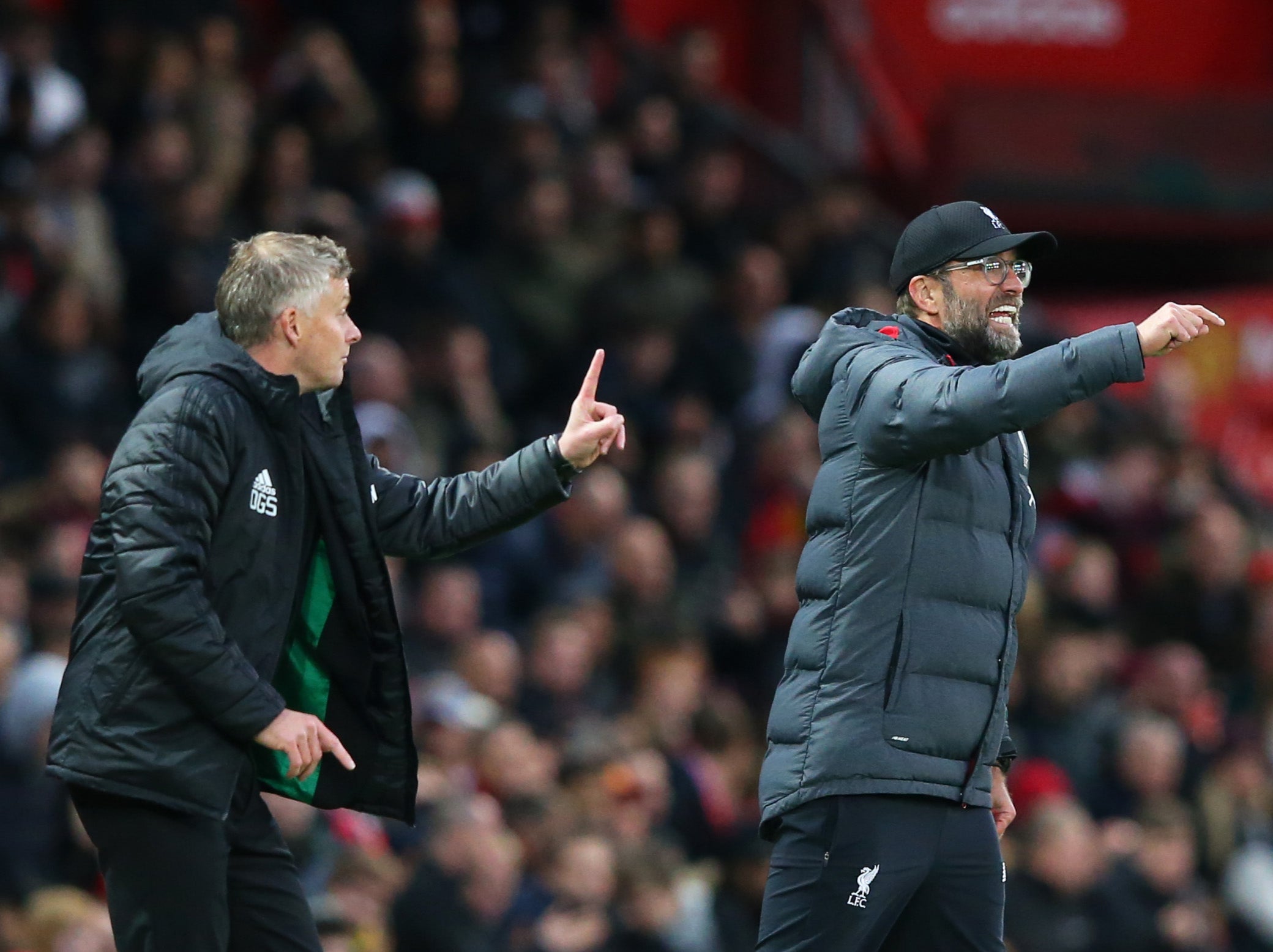 Manchester United coach Ole Gunnar Solskjaer (left) and Liverpool manager Jurgen Klopp