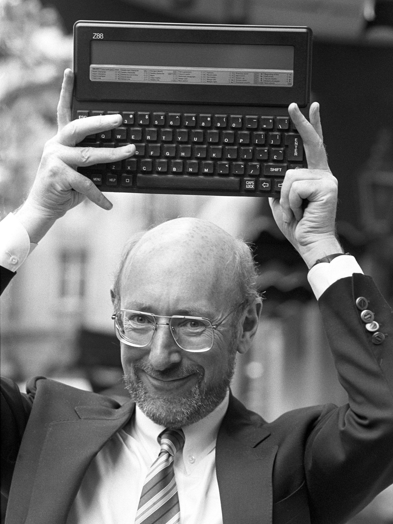 Sir Clive holds up the Z88 in September 1987