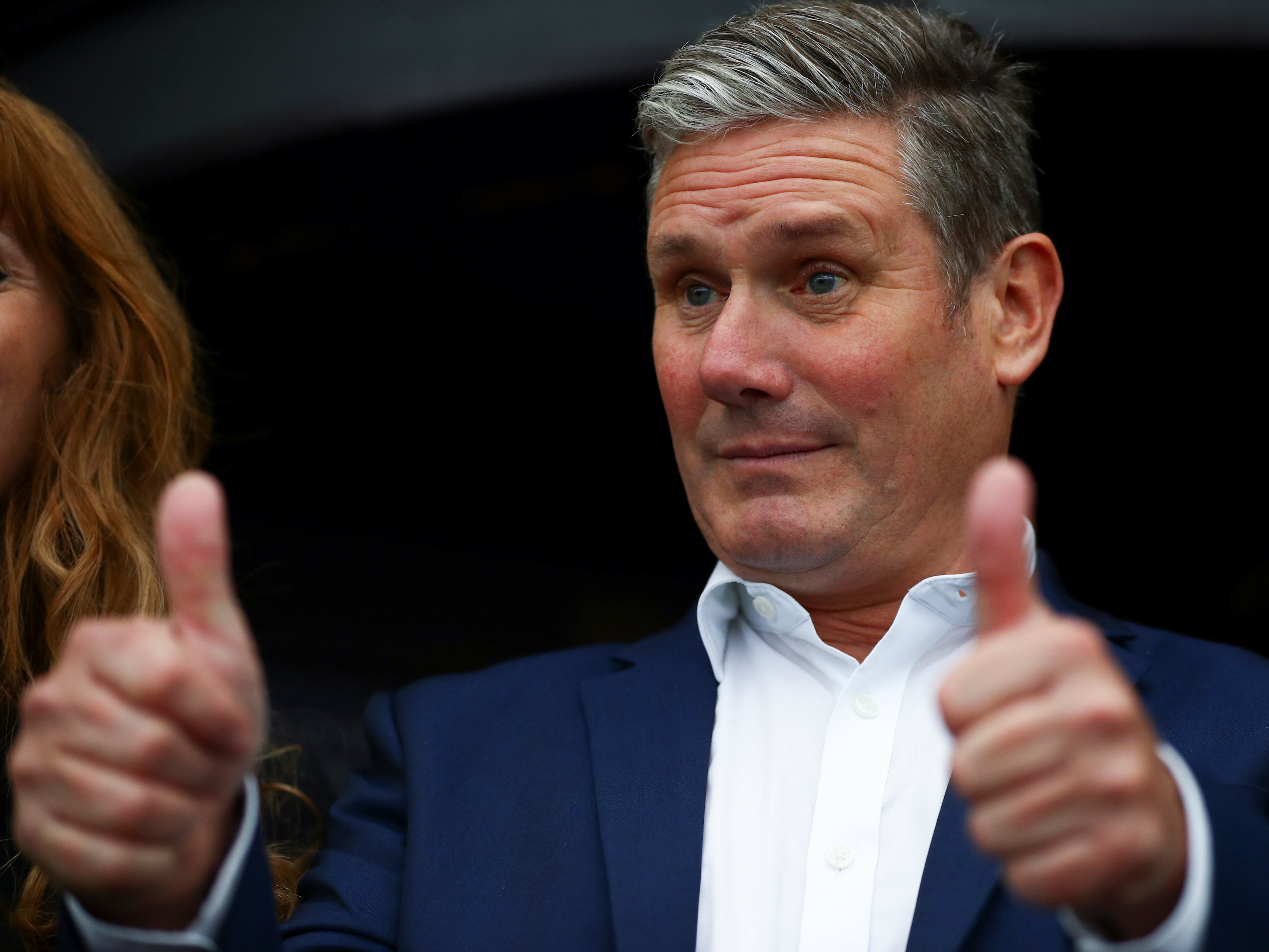 Keir Starmer puts on a brave face as he arrives at the Labour Conference in Brighton