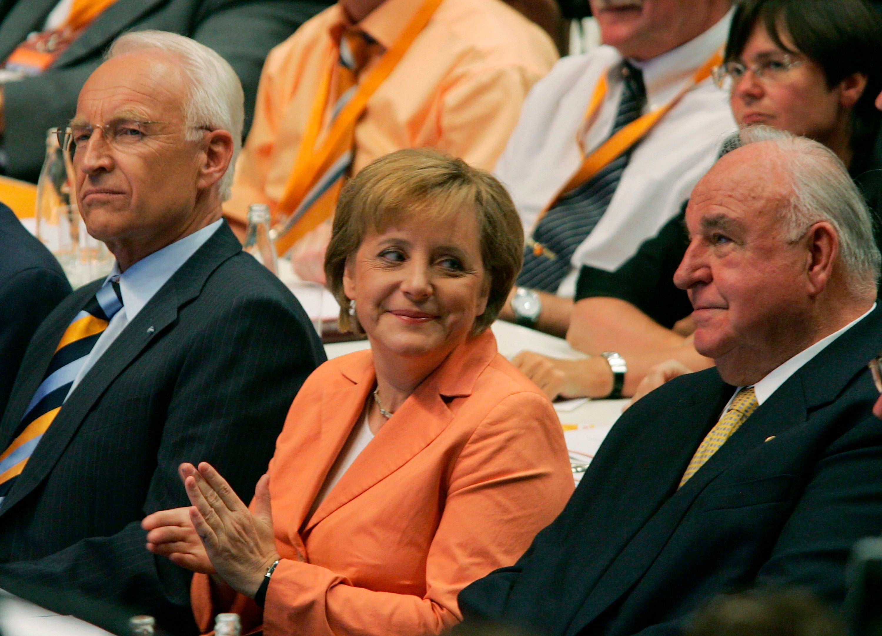 Merkel with Edmund Stoiber, head of the Christian Social Union (left), and former German chancellor Helmut Kohl (right) at the 2005 pre-election congress of the CDU