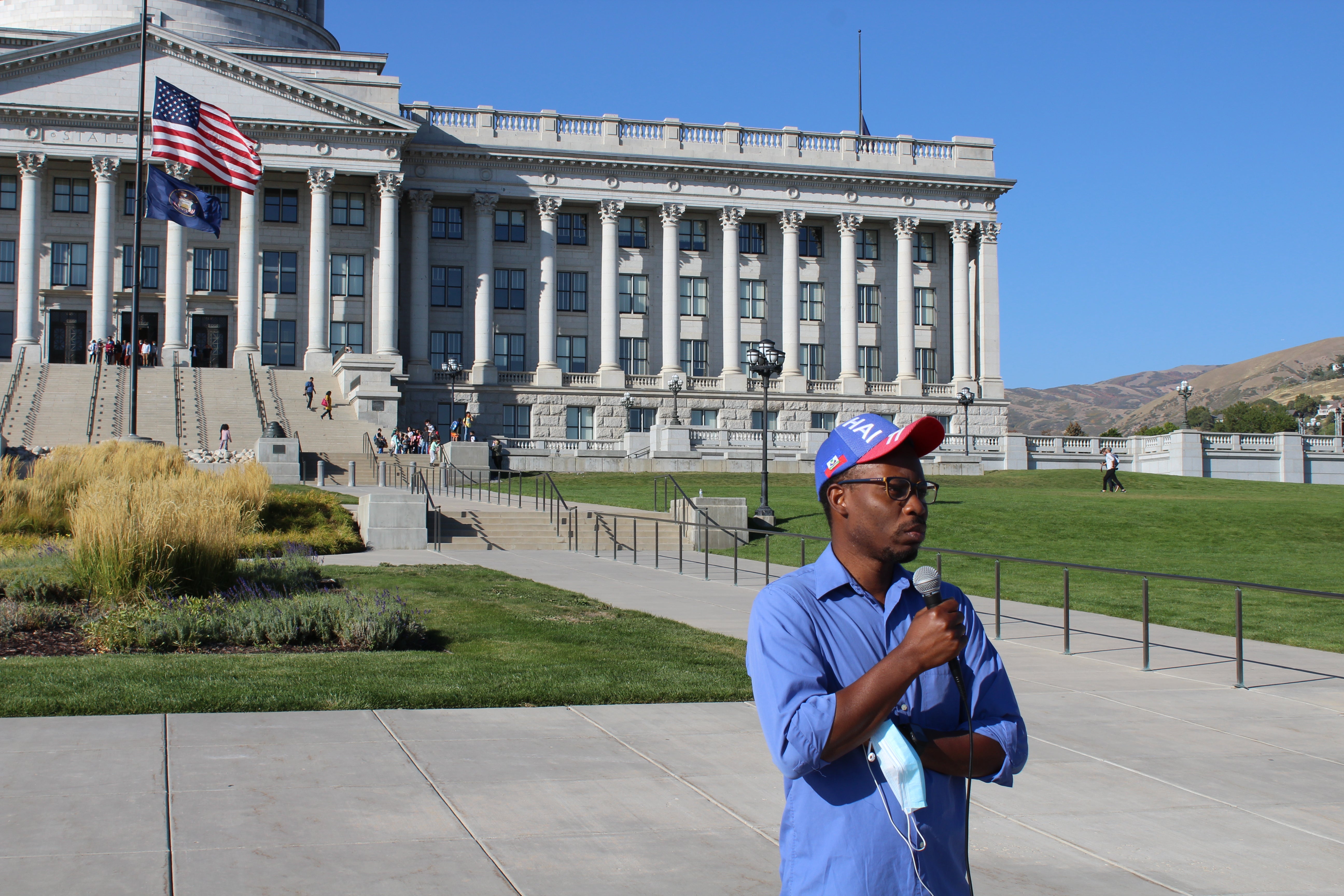 Haitian national Rony Charles addresses the small crowd gathered at the event. It’s really messed-up to see the way they’re treating humans,” he said of the images out of Del Rio, Texas.