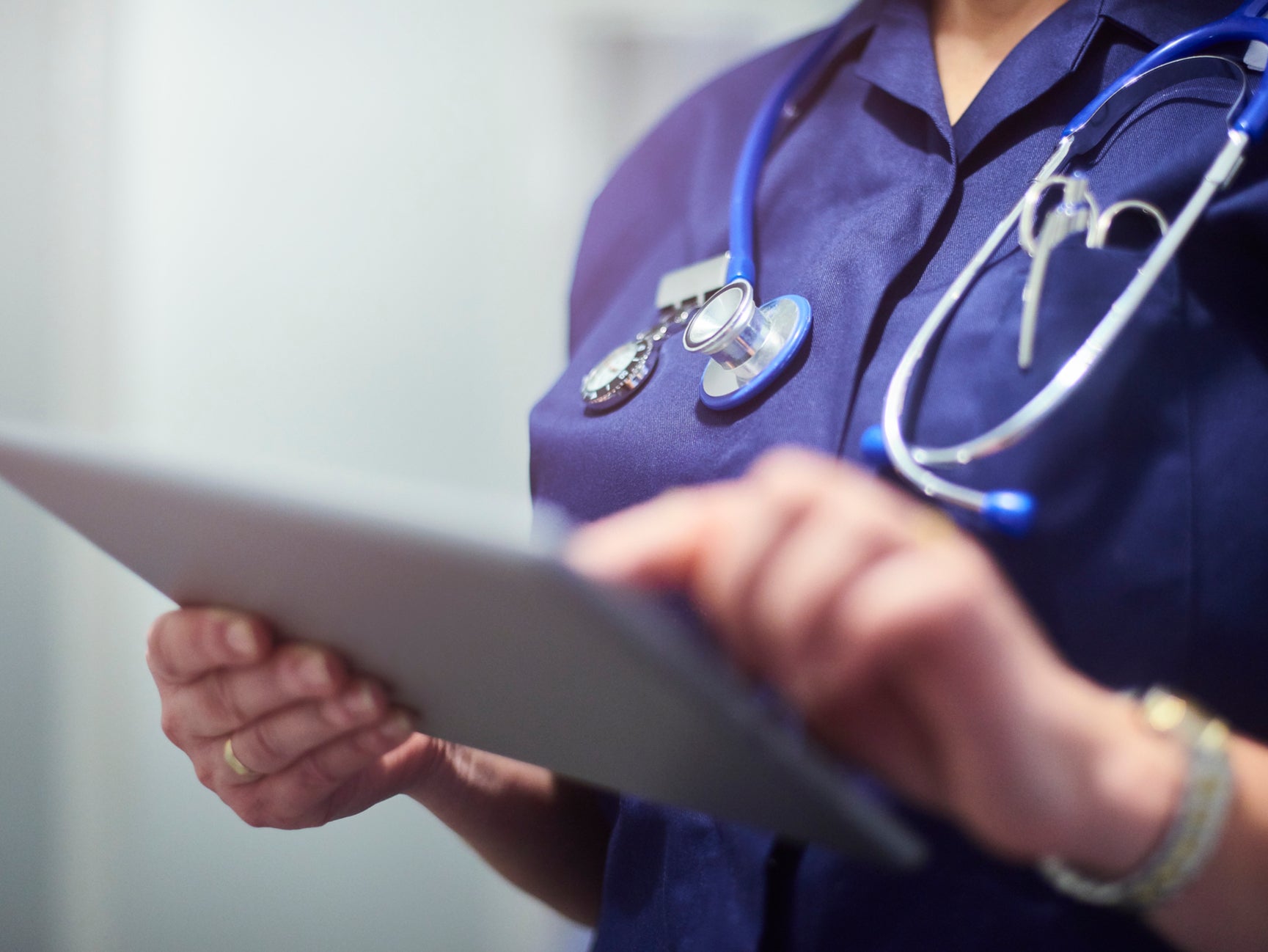 Female nurse using a digital tablet