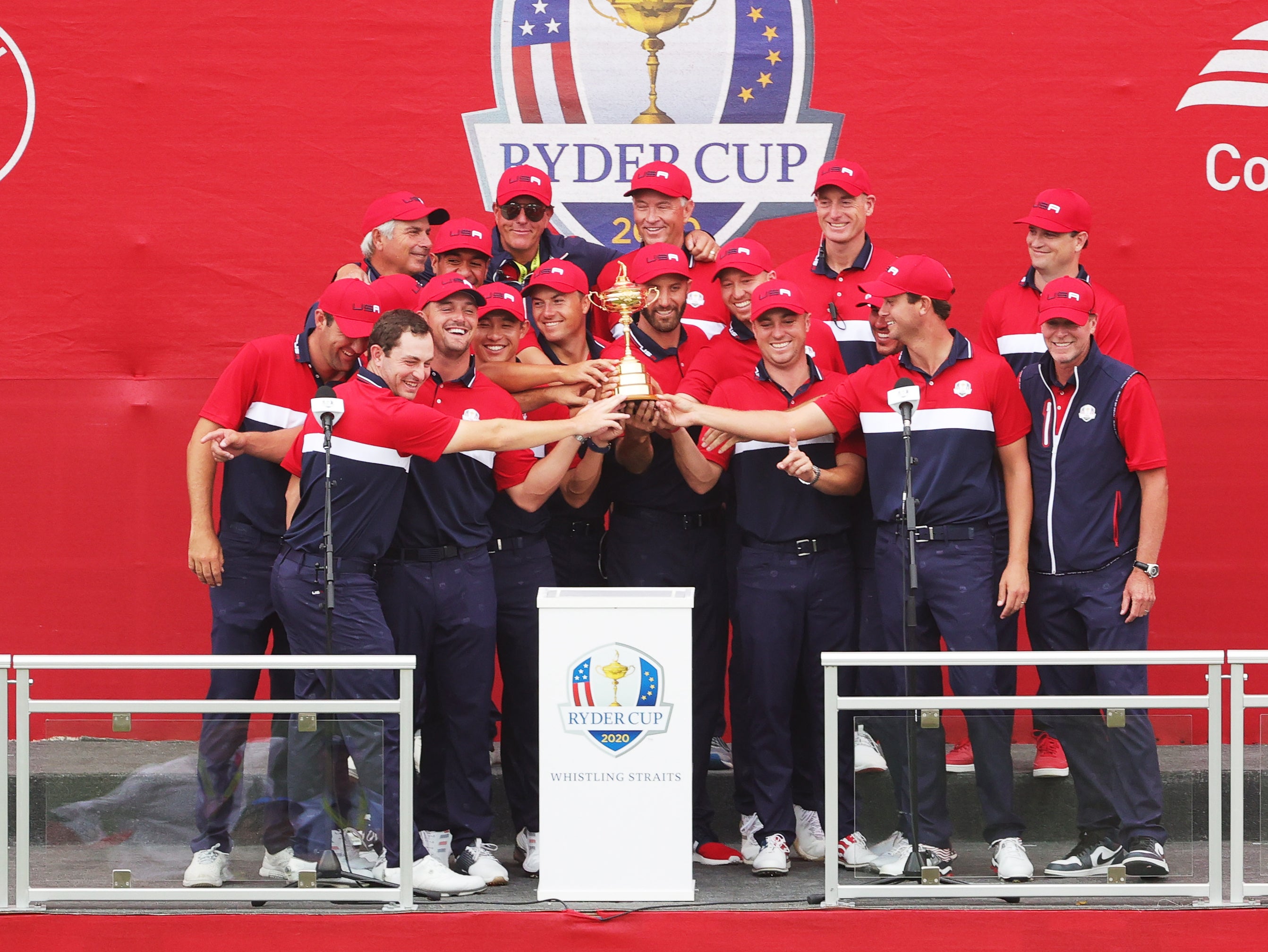 Team United States celebrates with the Ryder Cup after defeating Team Europe 19 to 9 in the 43rd Ryder Cup at Whistling Straits on September 26, 2021 in Kohler, Wisconsin.