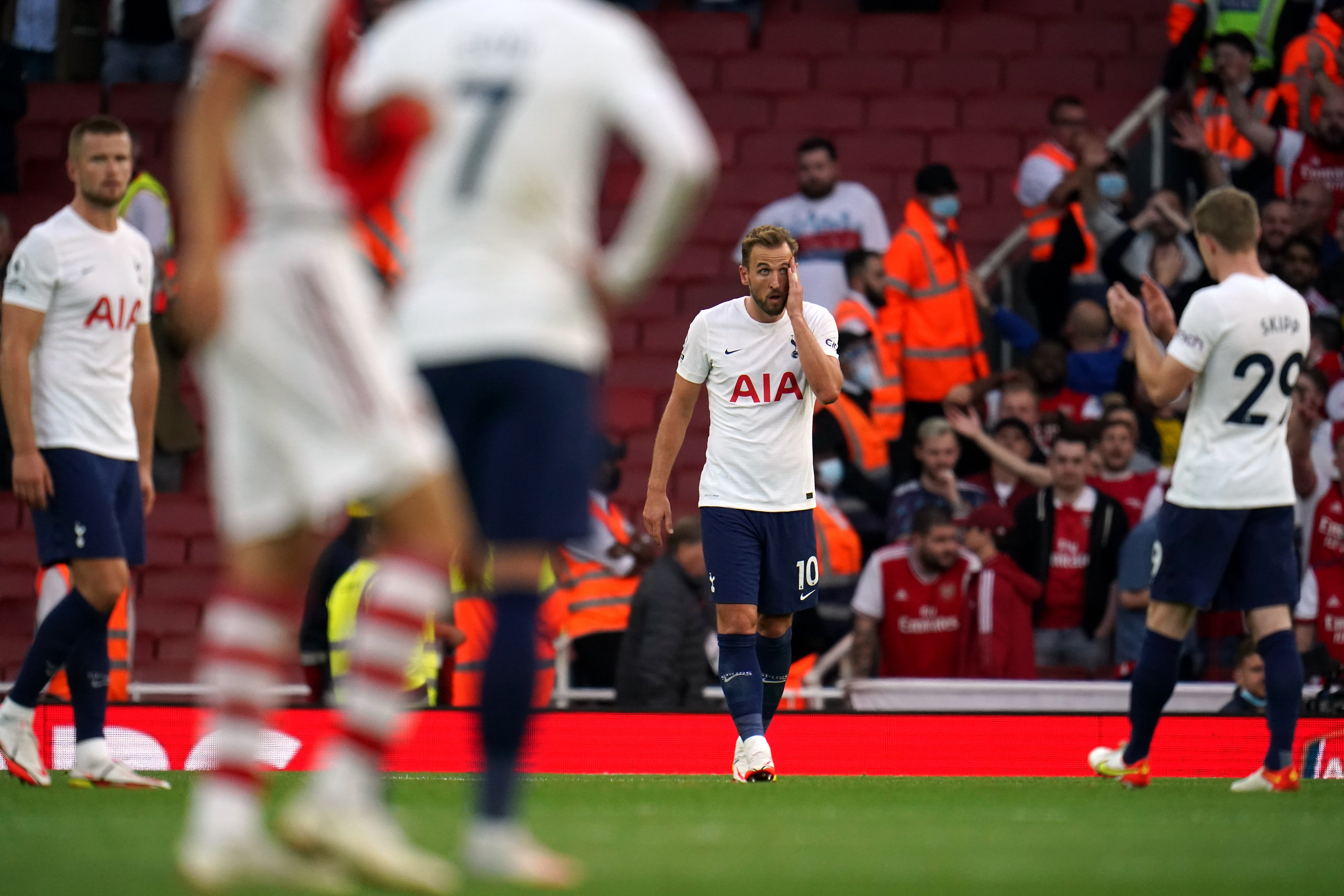 Harry Kane, centre, shows his frustration during Sunday’s derby defeat (Nick Potts/PA)