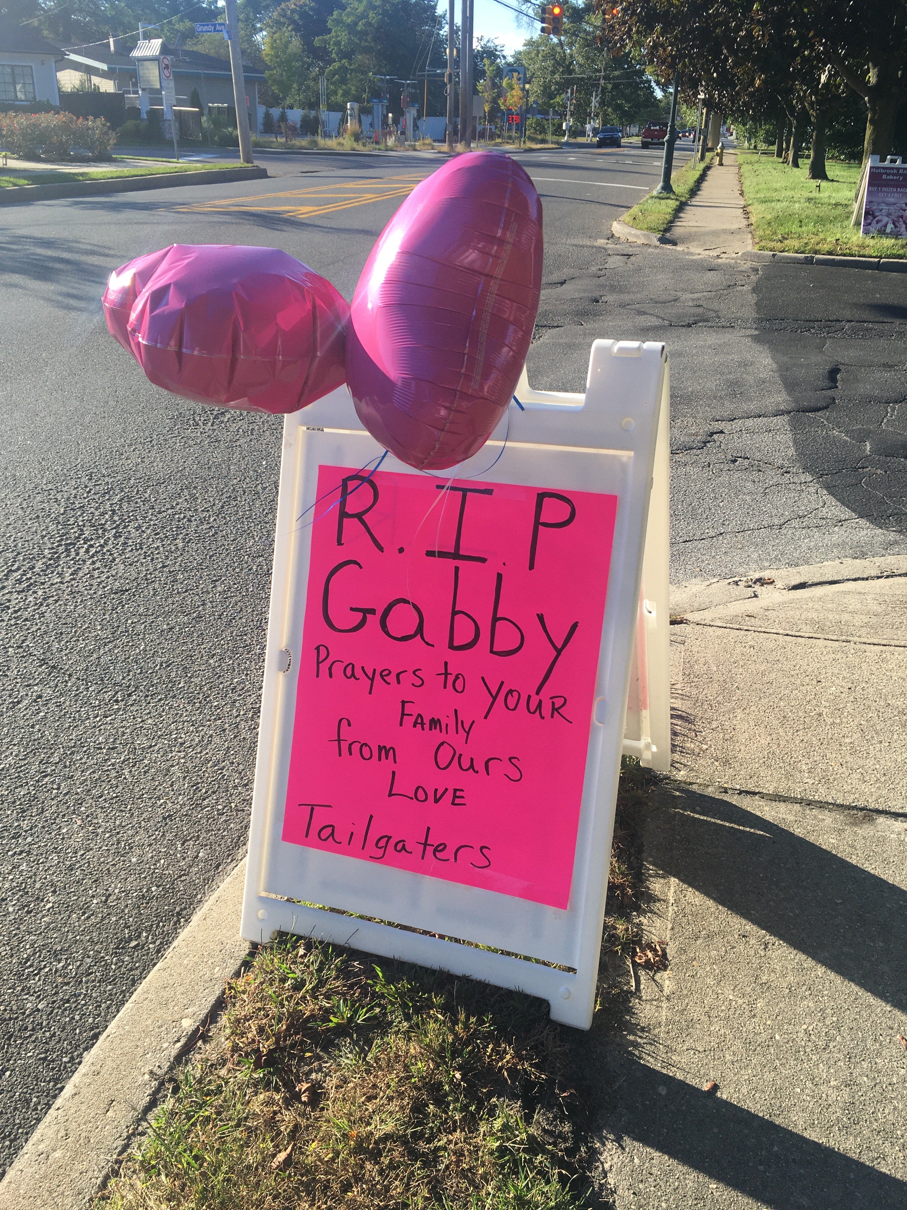 The Tailgaters bar in Holbrook, Long Island, left a tribute to Ms Petito on the side of the road near the memorial service