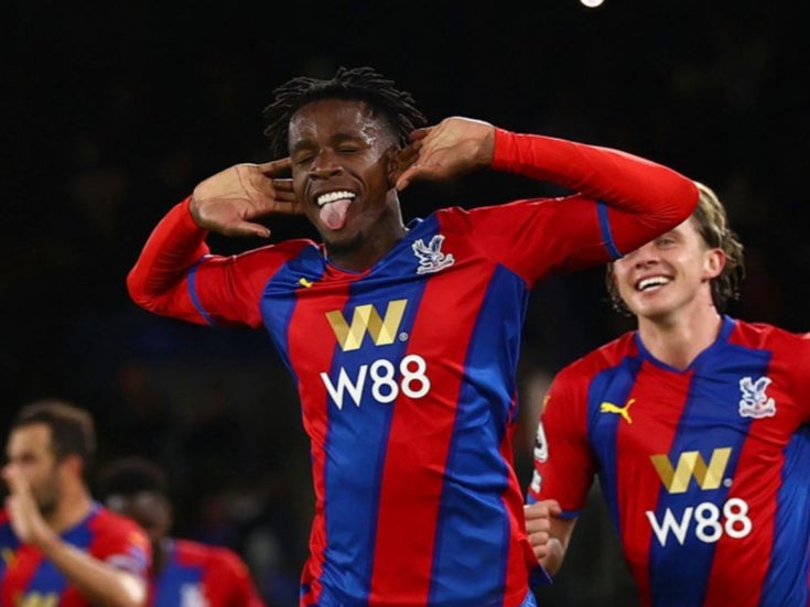 Wilfried Zaha celebrates scoring from the penalty spot