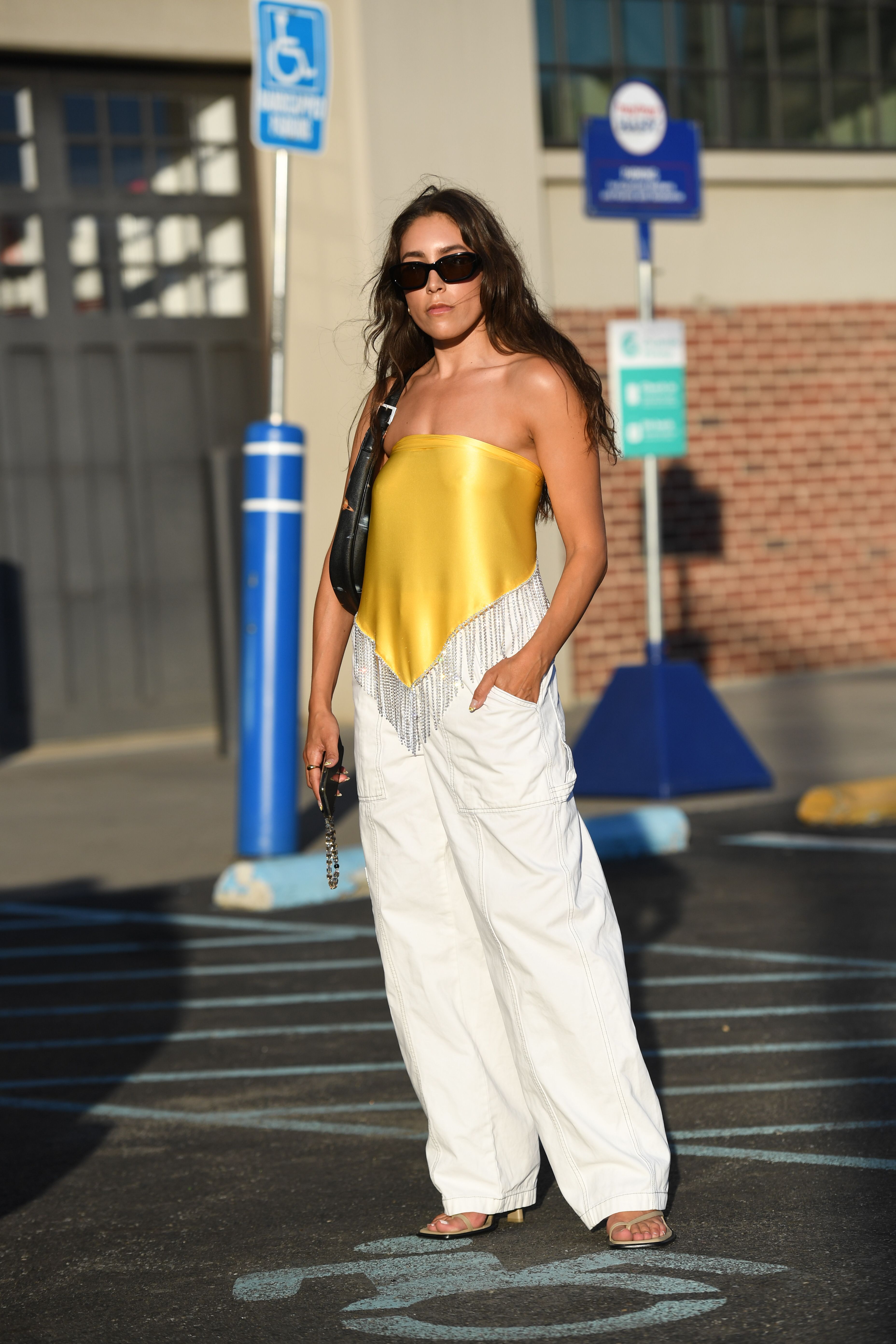 This yellow satin look top with diamante tassels pairs perfectly with these wide leg trousers and heeled toe thong sandals