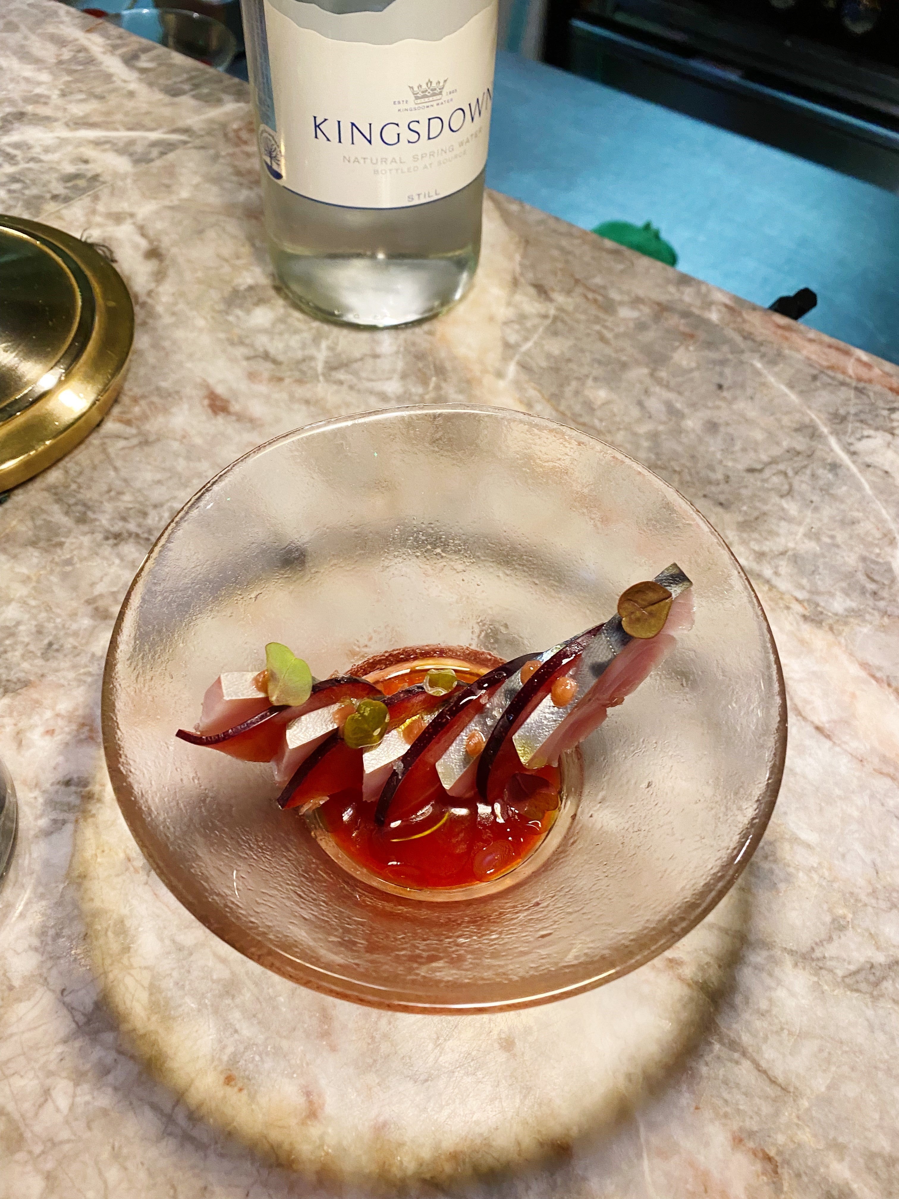 Sashimi mackerel slices are paired ingeniously with plum