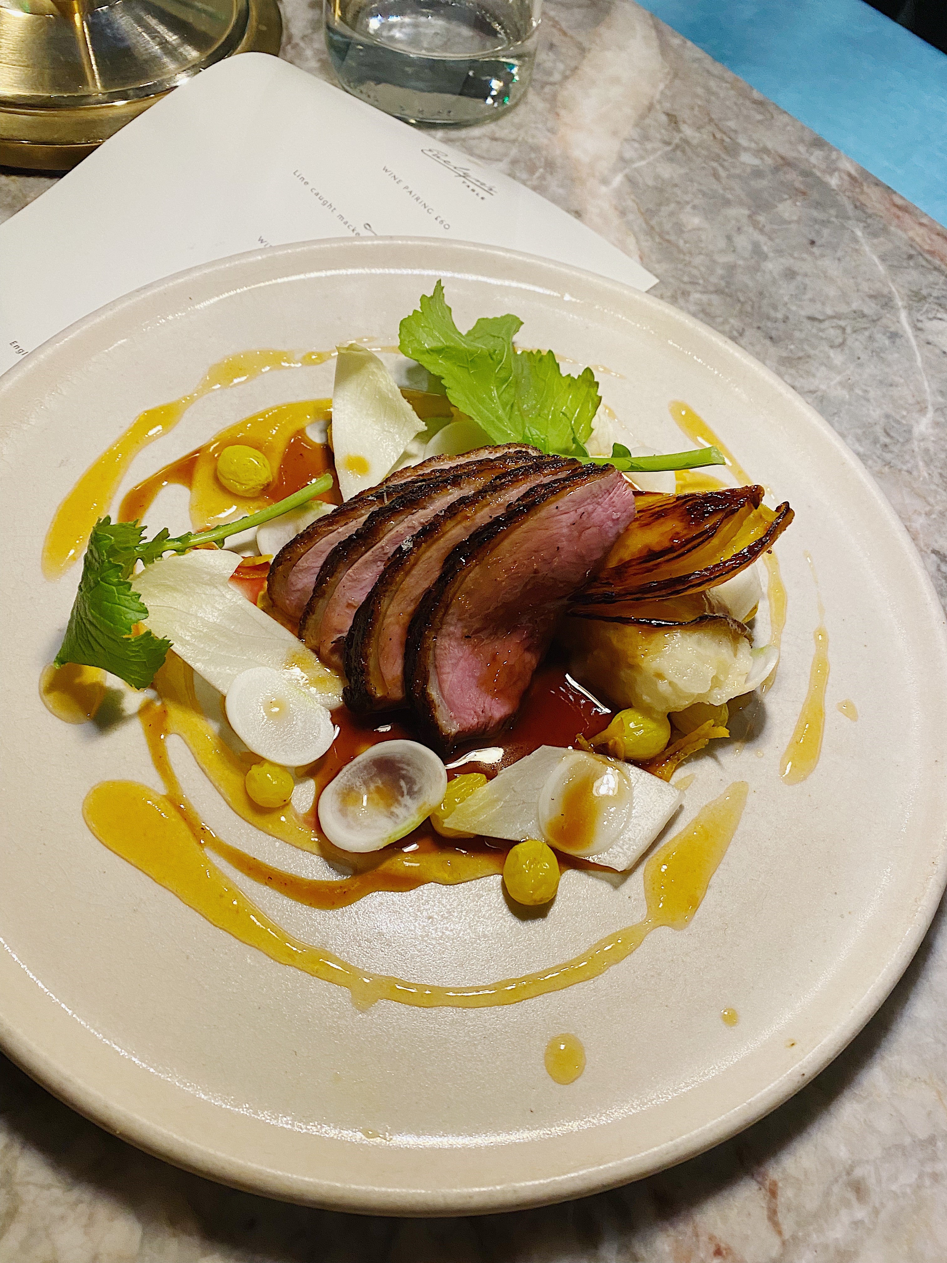 Dry-aged duck, smoked on the hibachi grill, served with marmalade sauce