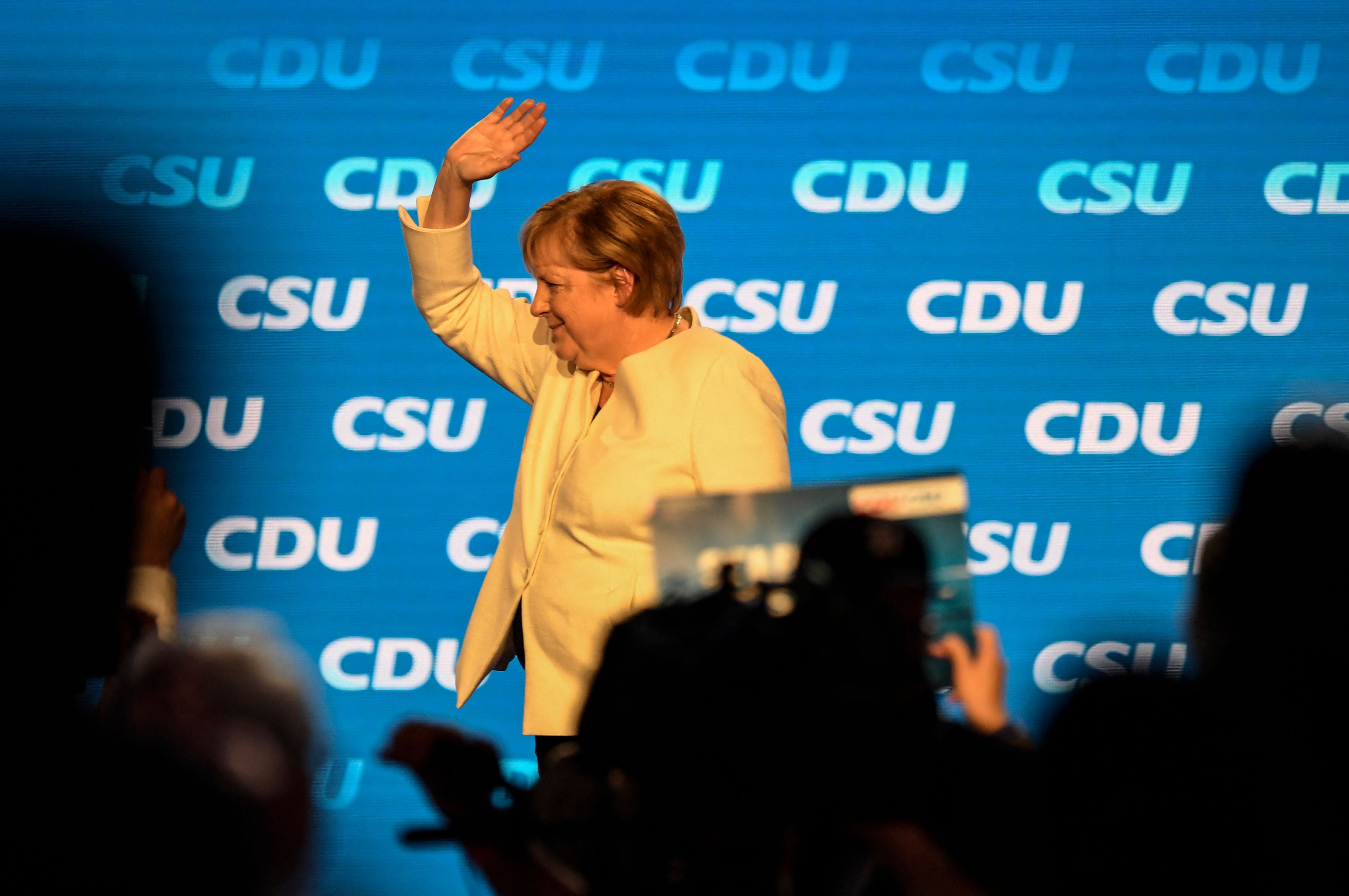 German chancellor Angela Merkel waves after delivering a speech ahead of the German federal election