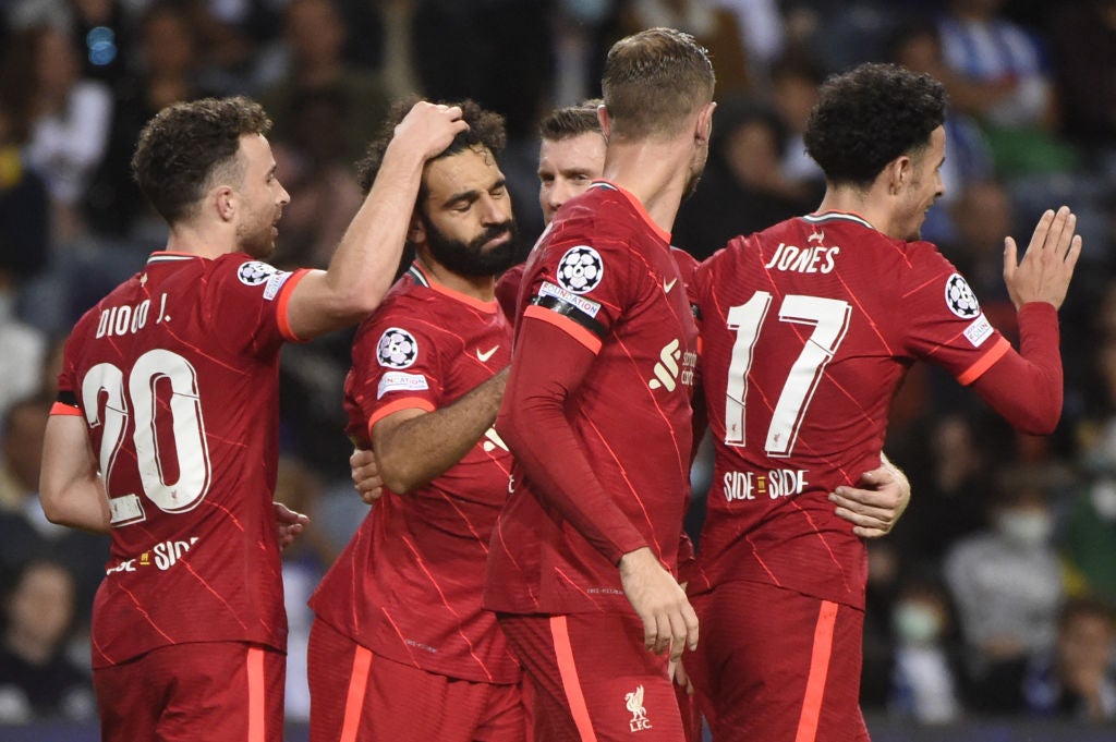 Mohamed Salah celebrates with his teammates after scoring