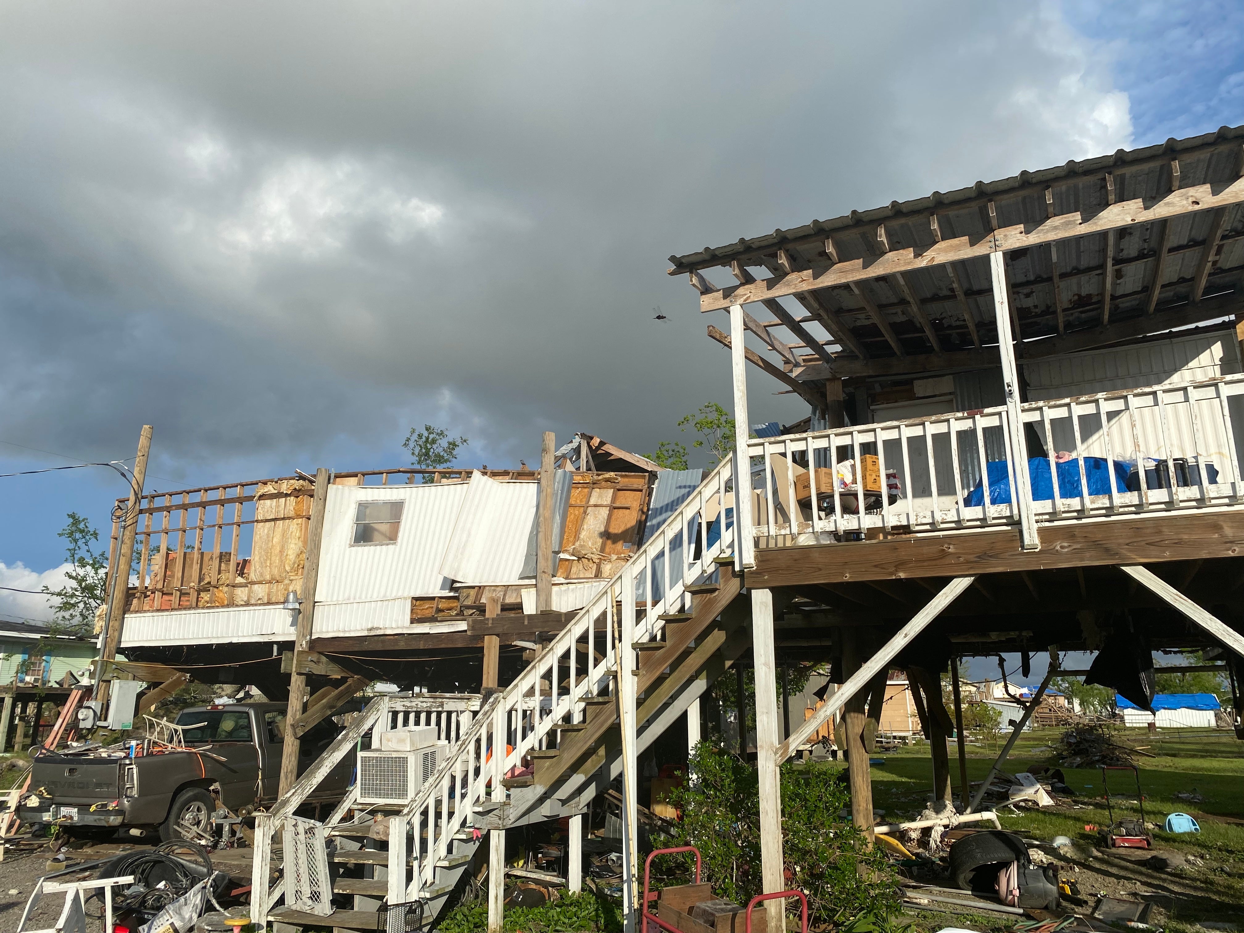 After her mother-in-law’s home in Chauvin, Louisiana was destroyed in Hurricane Ida, Kassy James and her family live in a small apartment in the building’s backyard.