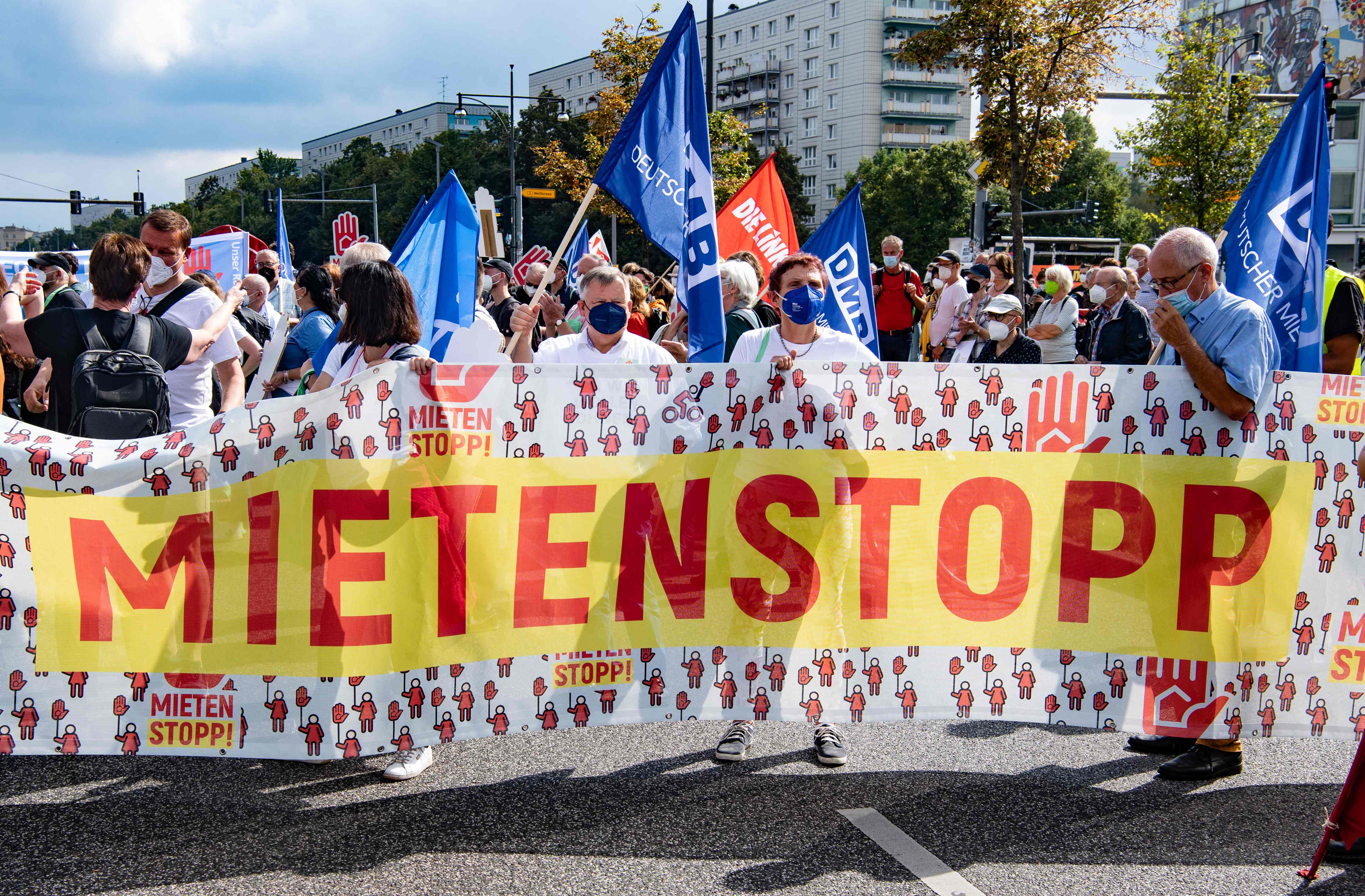 Demonstrators hold a banner reading ‘Rents cap' as they take part in a protest against the soaring living costs of tenants