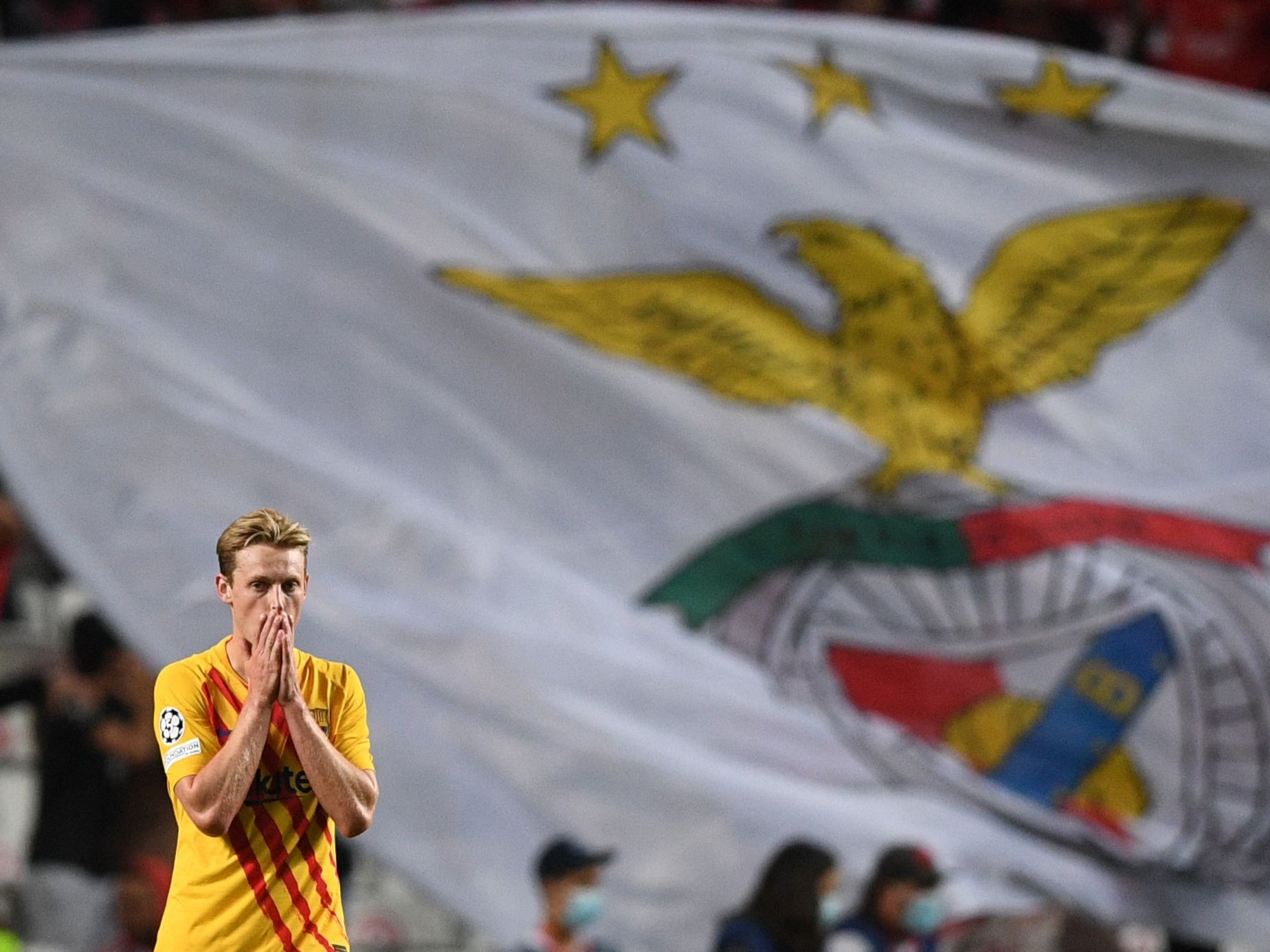 Barcelona’s Frenkie De Jong reacts after Benfica score at the Estadio da Luz