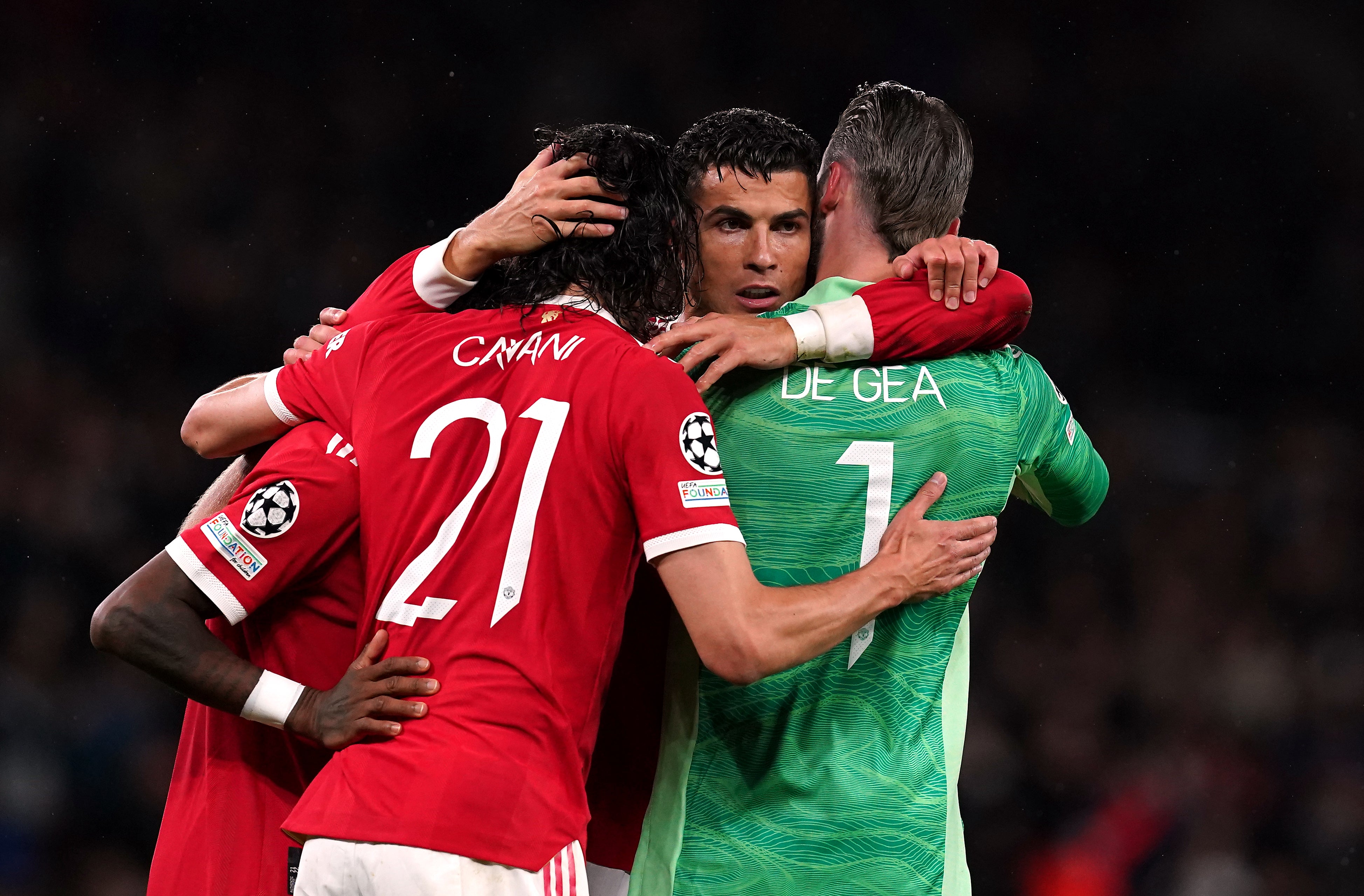 Cristiano Ronaldo is mobbed by his team-mates (Martin Rickett/PA)