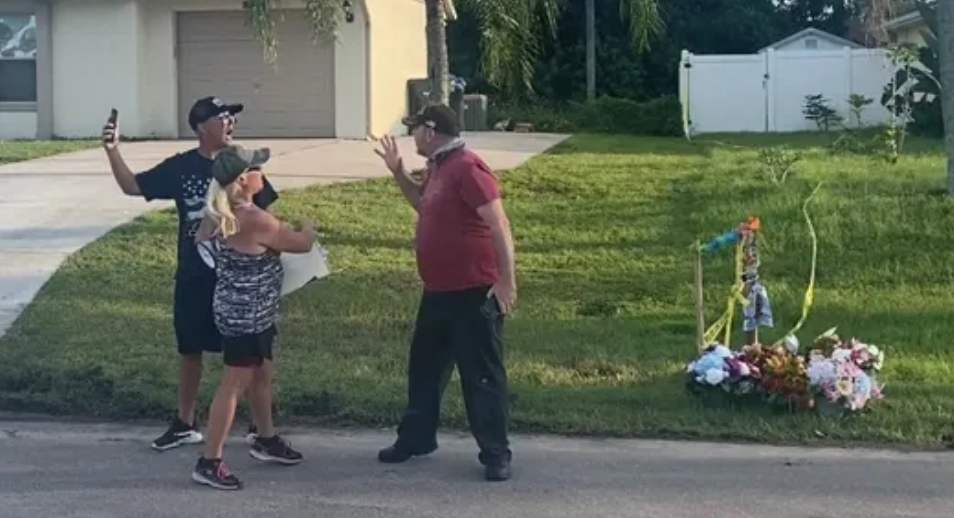 A Laundrie neighbour confronts a protester on Wednesday evening