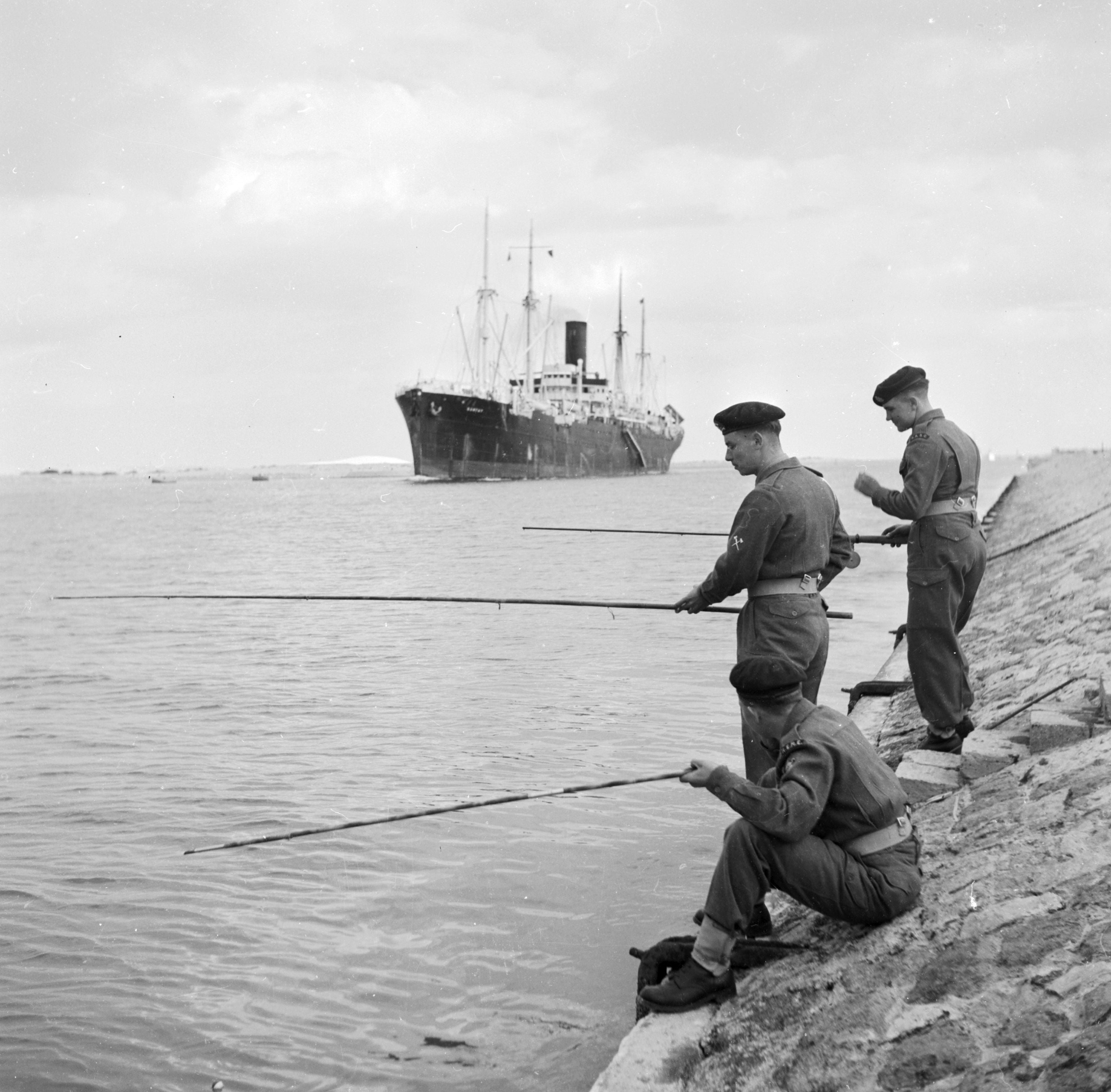 British soldiers fishing in the canal while stationed there