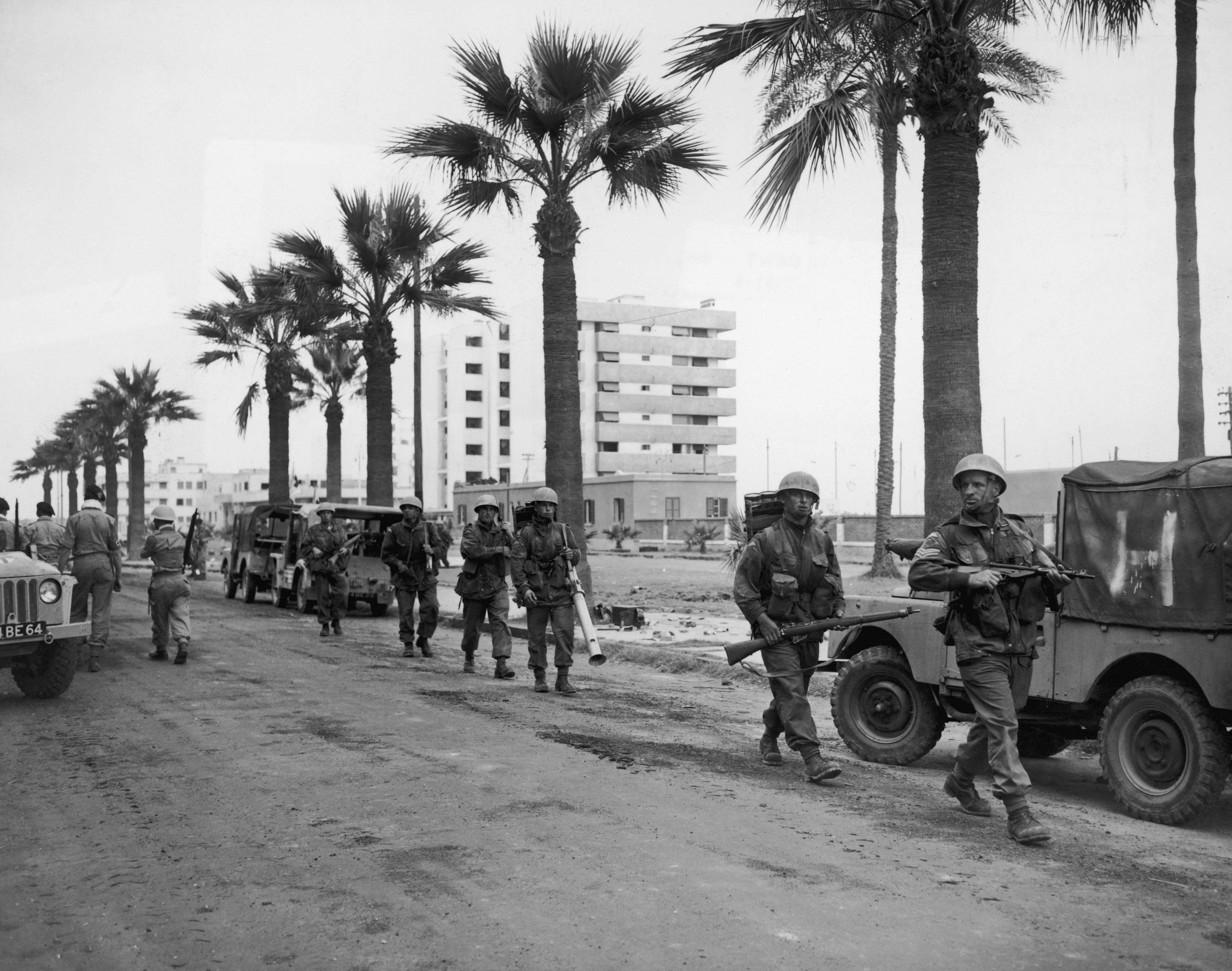 12 November 1956: British troops patrol a street in Port Said during the crisis