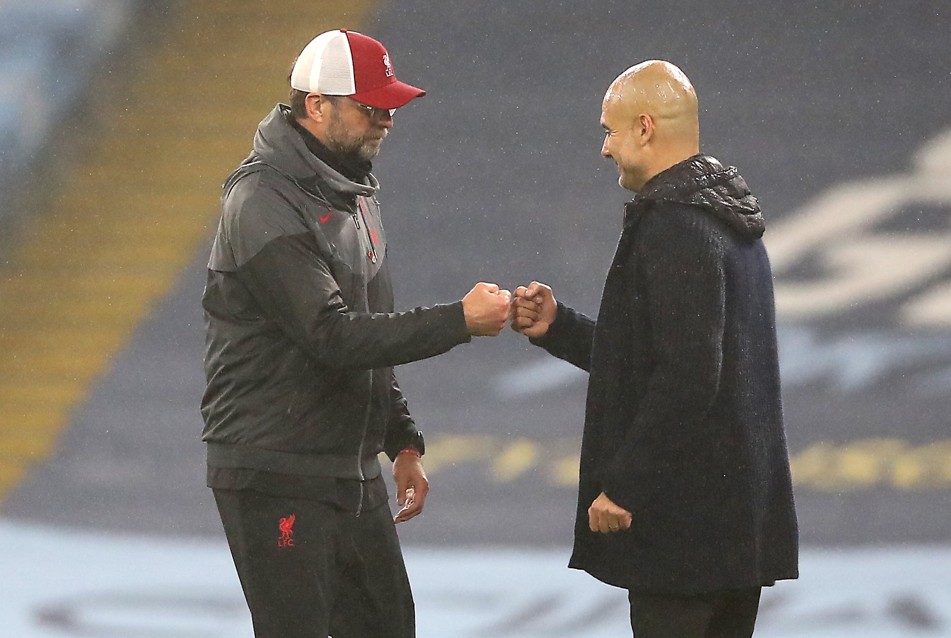 Pep Guardiola (right) and Jurgen Klopp (left) meet each other this weekend (Martin Rickett/PA)