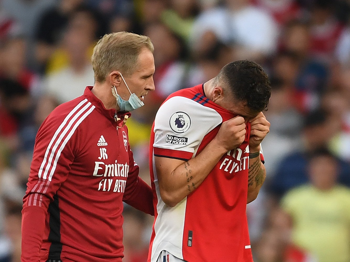 Granit Xhaka (right) reacts after sustaining an injury in Arsenal’s win over Spurs