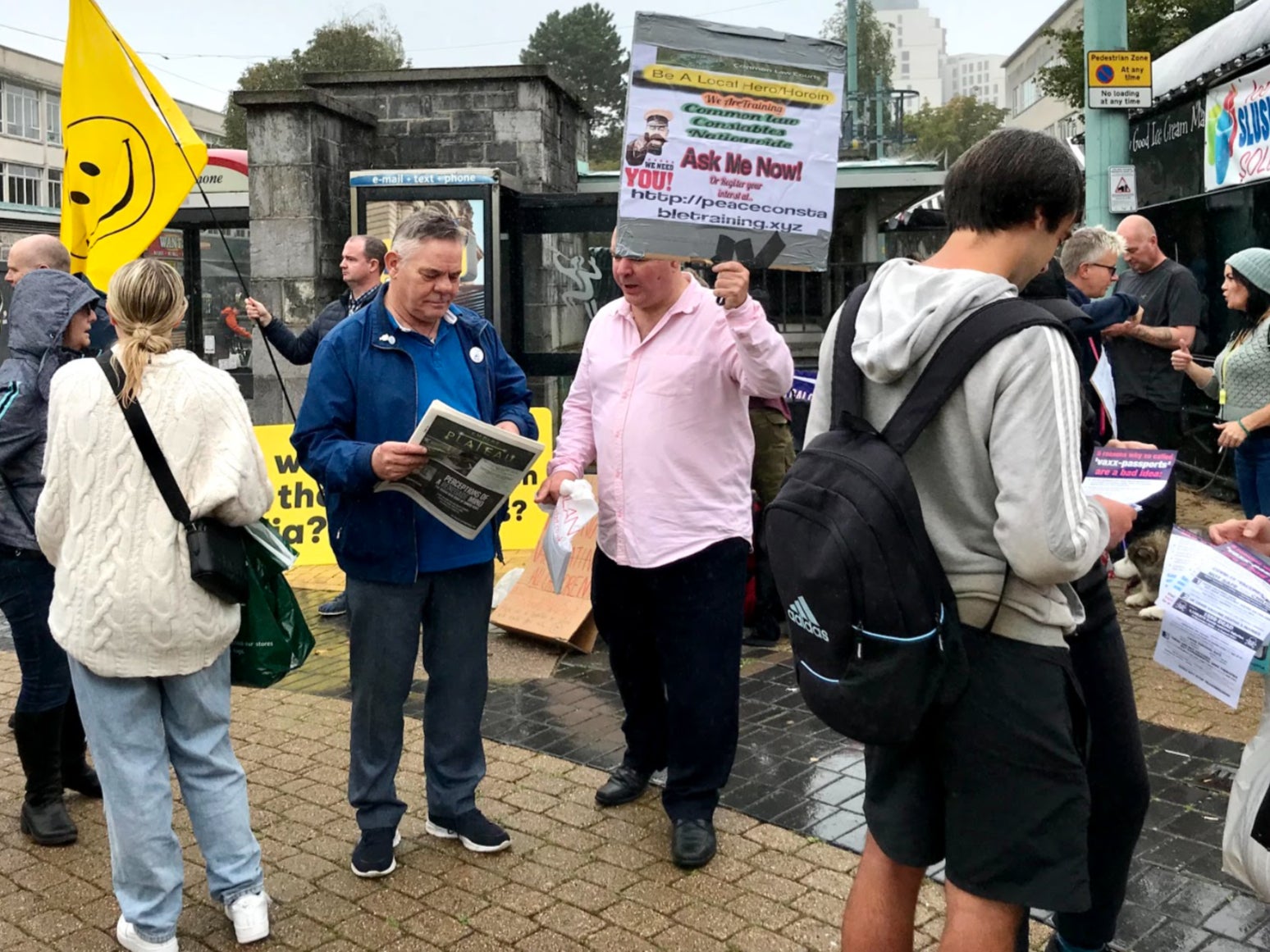 People attend an anti-vaccination protest in Plymouth