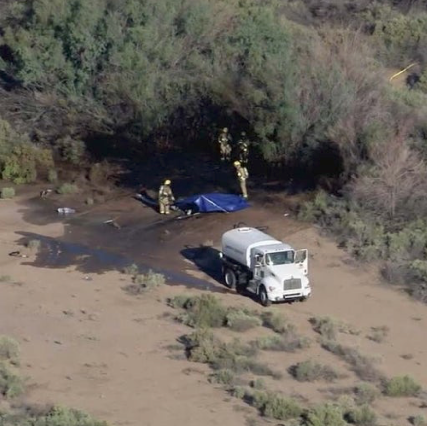 A shot of the crash site shows the helicopter caught fire on impact