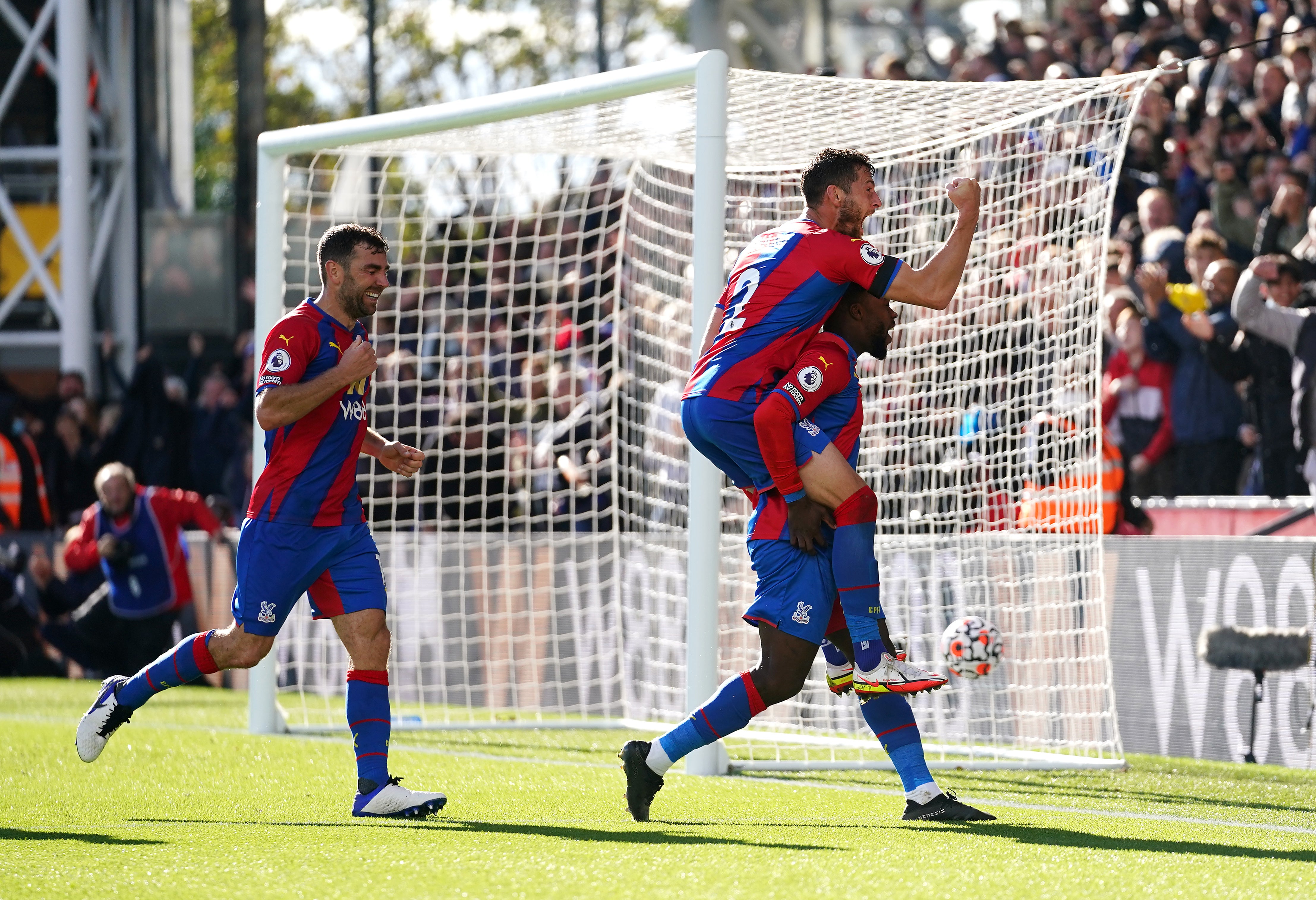 Crystal Palace’s Joel Ward piggy-backs on Jeffrey Schlupp after the latter’s equaliser