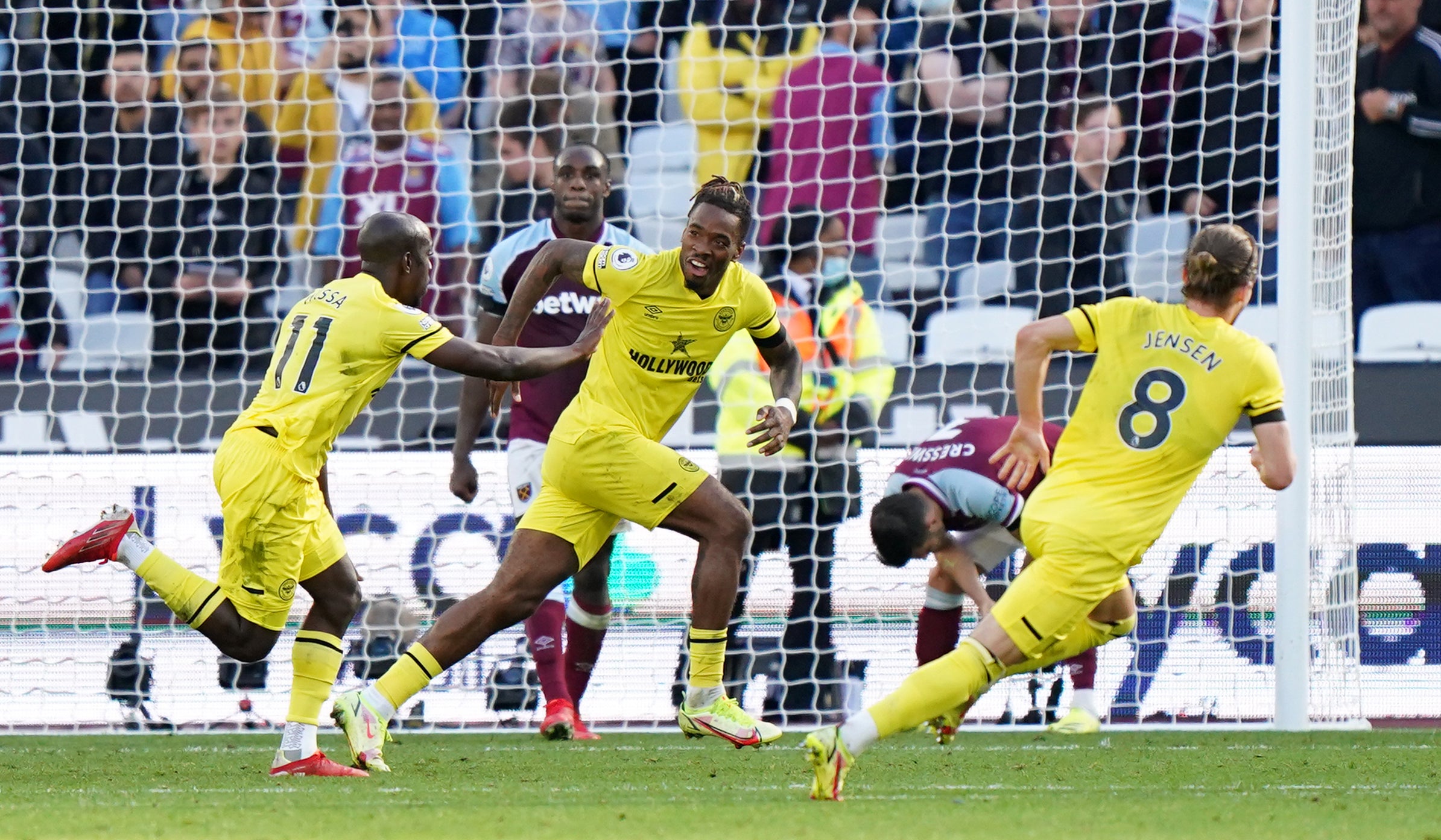 Yoane Wissa (left) celebrates his dramatic late winner for Brentford