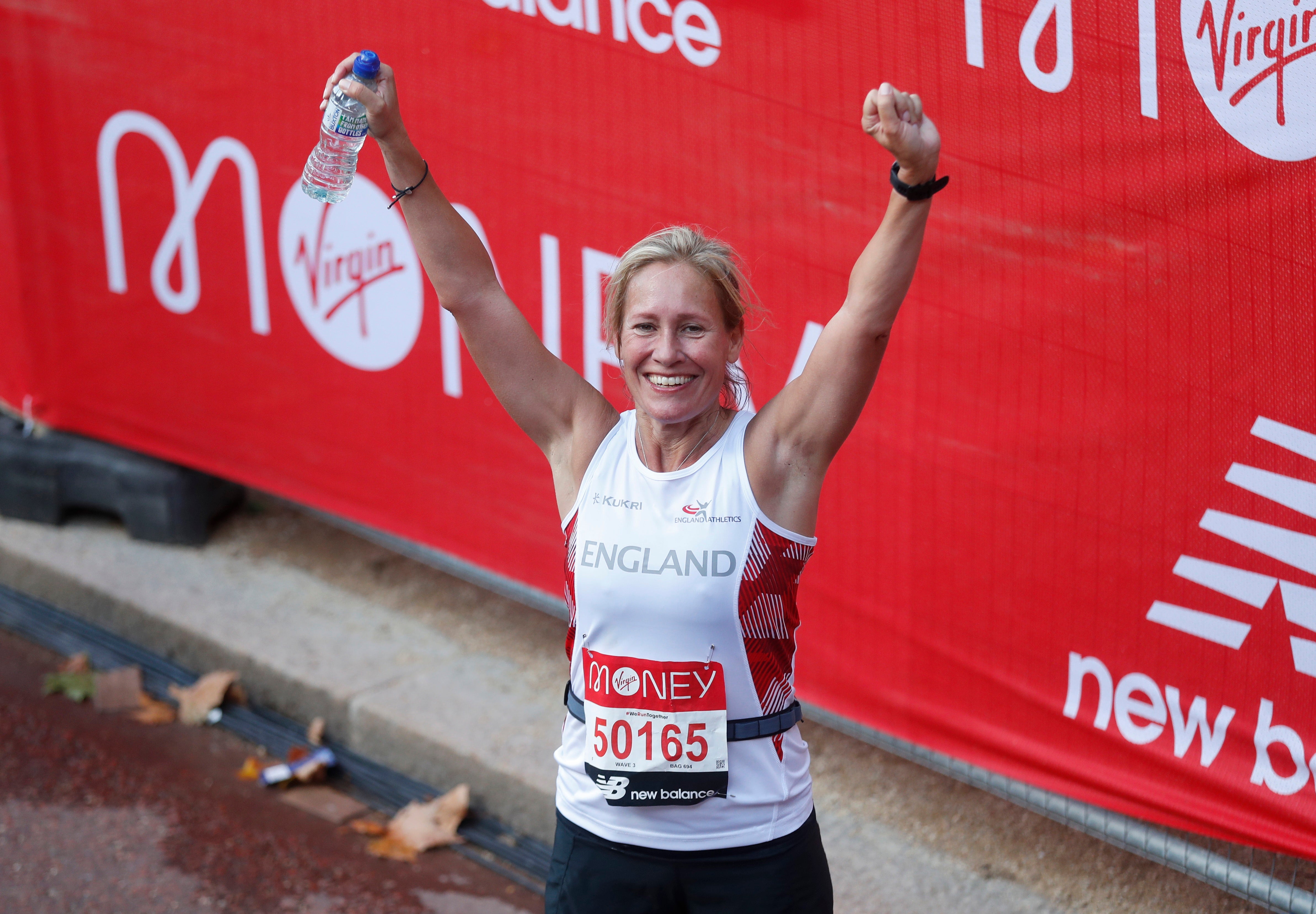 Sophie Raworth celebrates after finishing