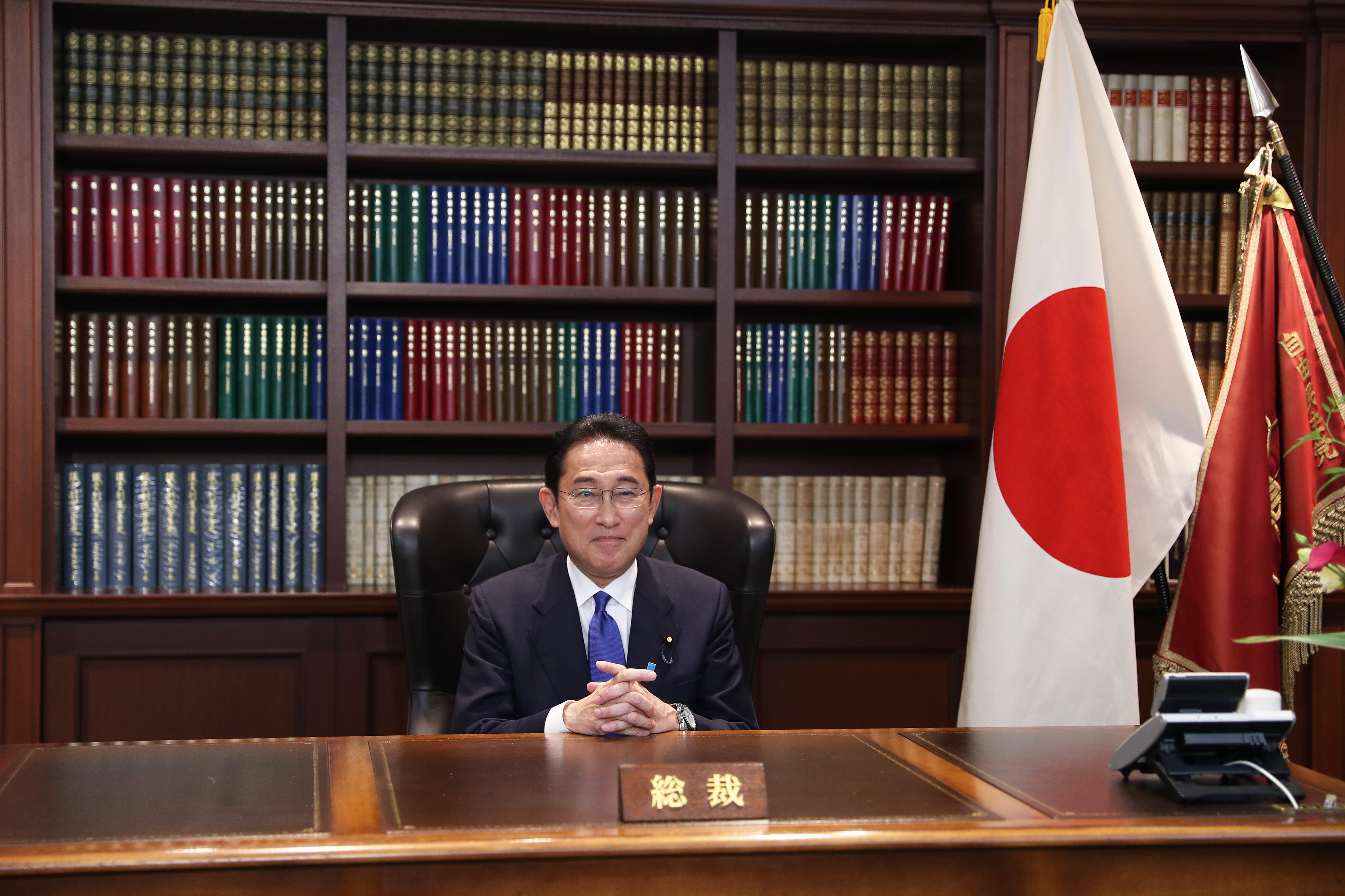 Japans former Foreign Minister Fumio Kishida poses for a photograph following a press conference after winning the ruling Liberal Democratic Party's presidential election