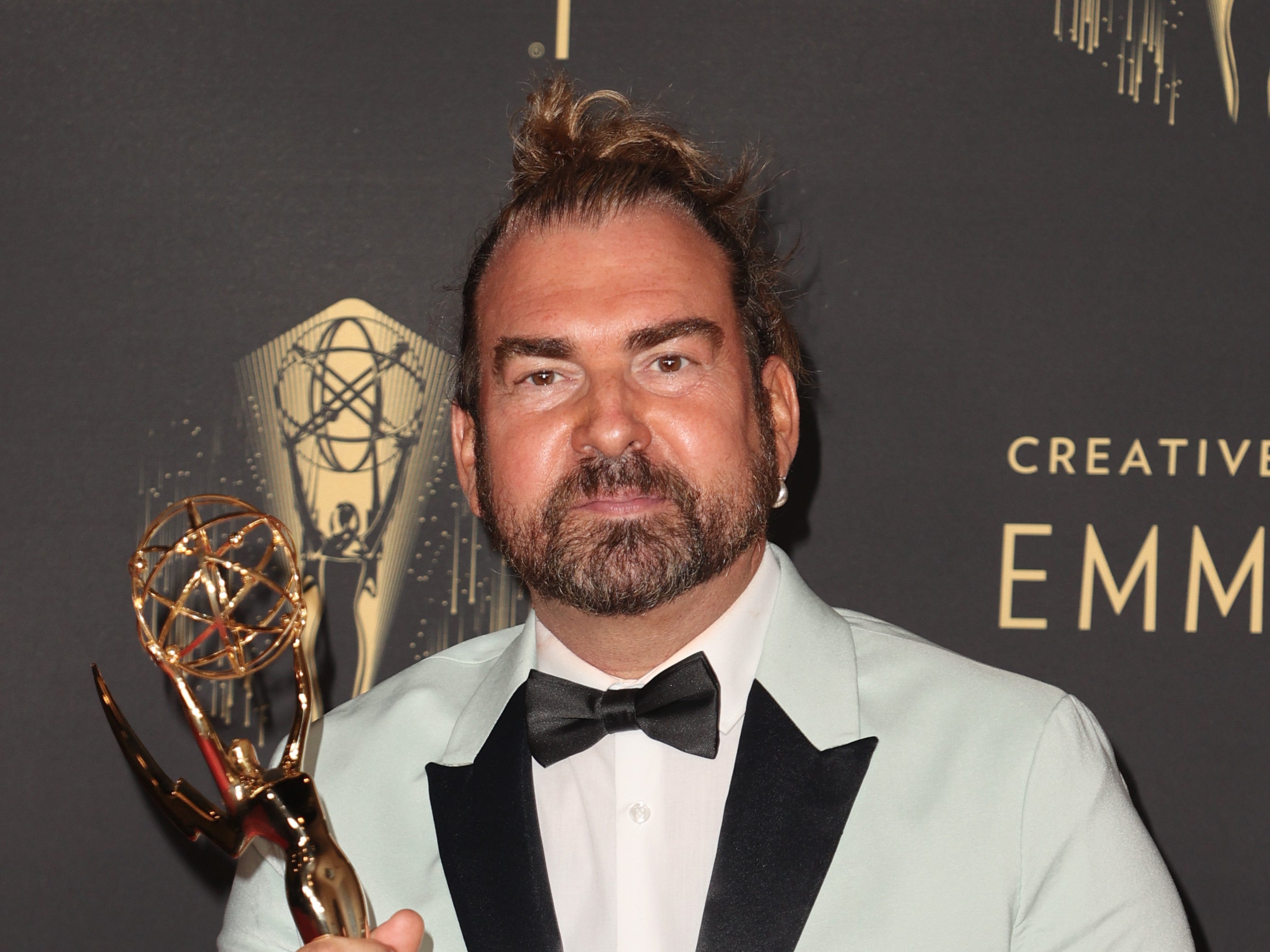 Marc Pilcher poses with the award for Outstanding Period And/Or Character Hairstyling for ‘Bridgerton’ at the 2021 Emmys