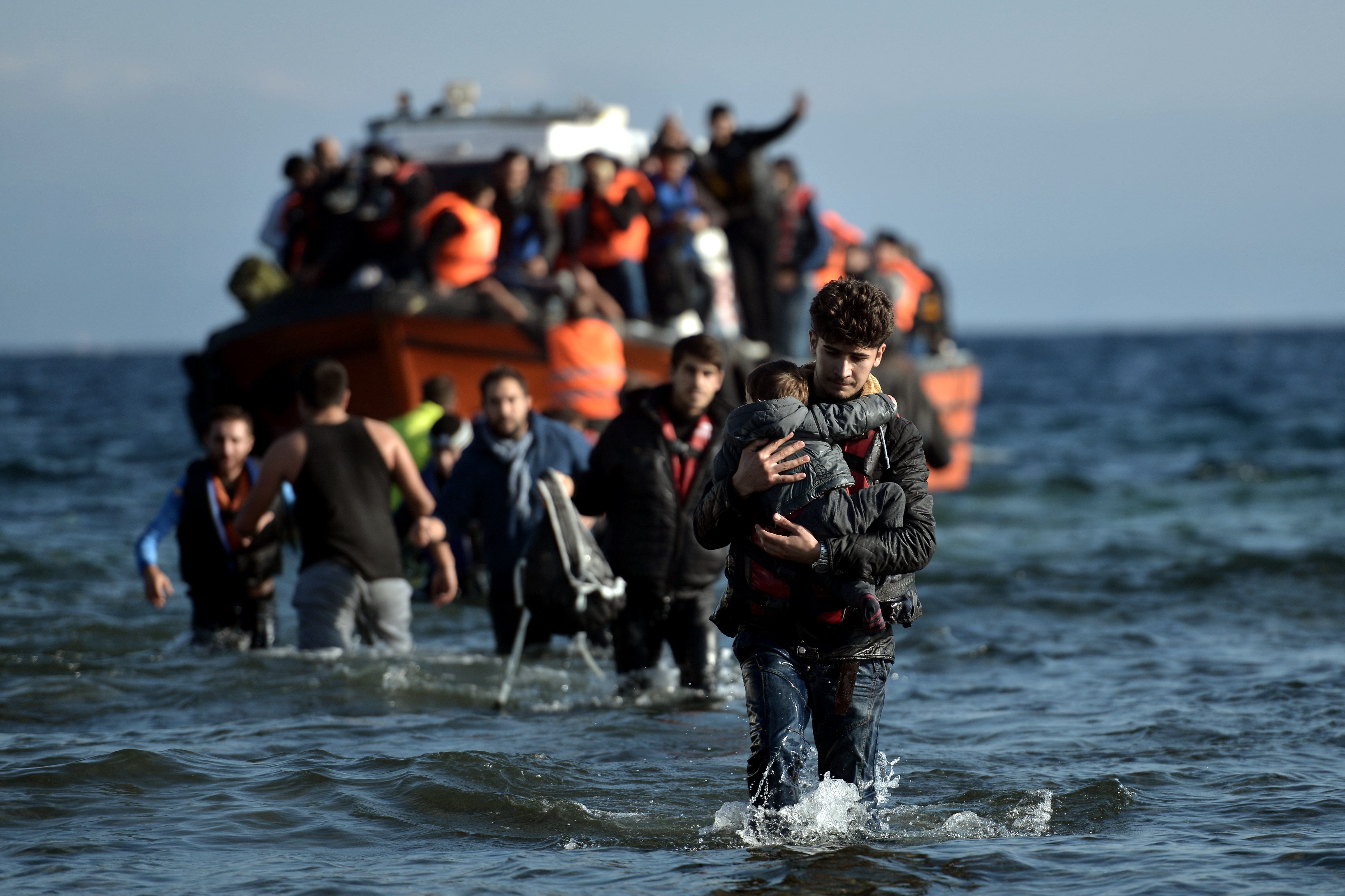 Refugees arrive on Lesbos after crossing the Aegean Sea from Turkey during the 2015 crisis