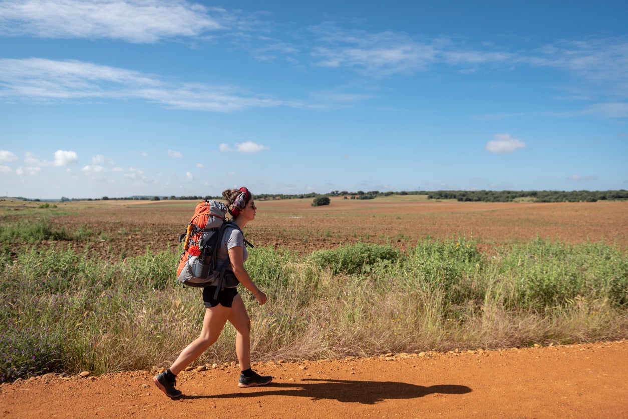 Pilgrim walking the Camino de Santiago near Astorga, Spain