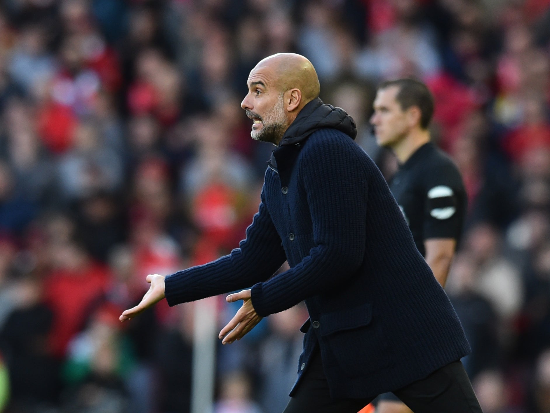 Manchester City coach Pep Guardiola on the sidelines at Anfield